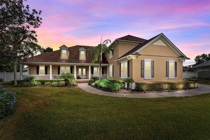 Welcome to the epitome of luxury living in the pristine community of Cypress Landing. This custom-built pool home, situated in The Estates of Cypress Landing, boasts 4 bedrooms plus an office, with the master suite and guest bedroom with bath located on the ground floor. With stunning hardwood flooring, lush mature landscaping with exquisite lighting, and a wealth of custom features, this property is the embodiment of elegance and comfort. The home's exterior exudes curb appeal with its large lot, nearly .5 acre meticulously manicured grounds and mature landscaping that surrounds the property. Exterior lighting accents the home's architecture, creating an inviting and warm ambiance. The Estates of Cypress Landing offers all custom homes in an exclusive and private setting within the community. Upon entering through the double glass leaded doors, you'll be greeted by the rich and gleaming hardwood flooring that flows throughout the main living areas. To the left, an inviting office with tray ceiling and double doors for privacy offers a perfect space for work or study. To the right is the large formal dining room with tray ceiling. The heart of the home is the custom-designed kitchen, featuring a cooktop, built-in oven and microwave, dishwasher, granite countertops, huge pantry, numerous cabinets with built-in desk, and an oversize central island. The open-concept design seamlessly connects to the nook & family area, which boasts lots of light, built-in shelving & a fireplace, creating a cozy and stylish space for relaxation. The ground-floor master suite is a true haven, offering a spacious retreat with crown molding and ample natural light. The in-suite bathroom is a masterpiece, featuring a double vanity, a soaking tub, a separate shower, and custom tile finishes. A generously sized walk-in closet completes this luxurious space. Downstairs you’ll also find the spacious laundry room with sink, counter, laundry chute and additional storage cabinets. Heading upstairs, you'll see two more well-appointed bedrooms, each offering comfort and style. These bedrooms are complemented by beautiful bathrooms, ensuring convenience for all occupants. The spacious loft area is perfect for an additional family room, craft room, or child’s play area. Another 85 sq.ft. heated storage area is located off the loft area. The outdoor living space is equally impressive, with covered lanai, screen enclosed pool/spa, pavered patio, lush landscaping, vinyl fencing surrounding a well-maintained lawn, and outdoor lighting to create an enchanting atmosphere. It's an ideal spot for outdoor gatherings and relaxation. The side entrance 3 car oversized garage offers more storage space on top of plenty of space for your vehicles. This custom-built masterpiece in The Dr. Phillips area offers an unparalleled combination of luxury, style, and comfort. $60,000 recently spent on new custom double pane energy efficient windows. Corporate Relocation motivates the sale of the owners’ dream home creating an opportunity where your family's dreams can come to life, a place to make memories, and an environment that exudes elegance. Includes access to a playground, park, and tennis courts for residents. Supreme Location with easy access to major highways, Resorts, shopping, and elegant dining on Sand Lake Rd.  Contact us today to schedule a viewing and experience its grandeur firsthand. Please be sure to view the attached 3D Matterport Tour!