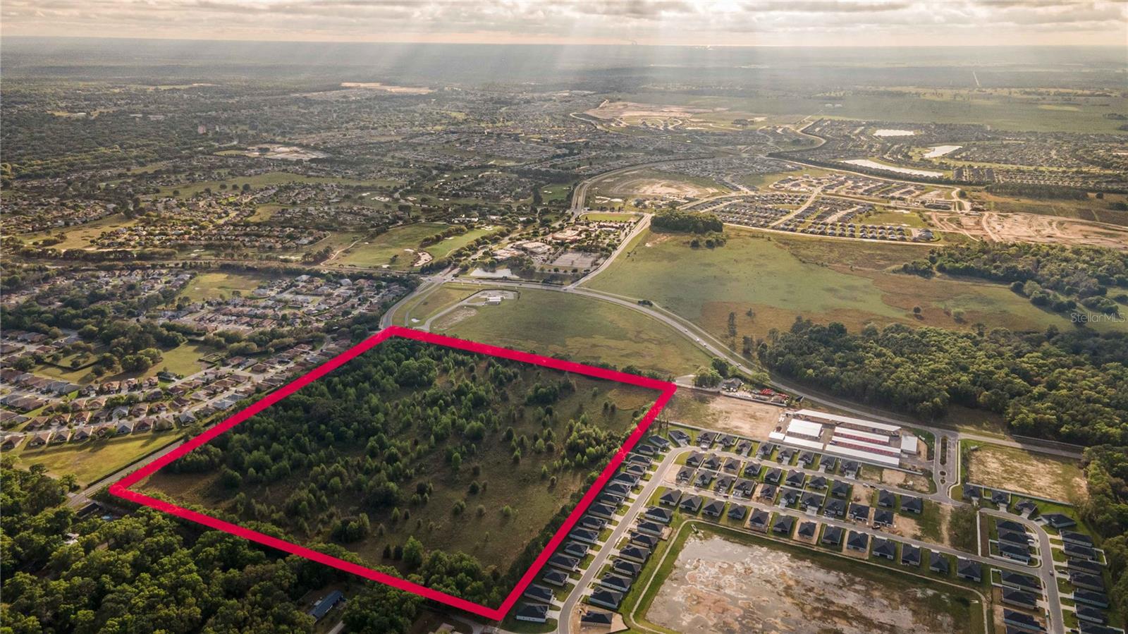 Welcome to the heart of Ocala's ever-growing western expansion and development, where opportunity abounds with this exceptional 40-acre vacant land parcel located just off SR 200 abutting to On Top Of The World and Lennar Homes at Liberty Village. This stunning property is high and dry, boasting an impressive array of mature hardwoods that provide both beauty and privacy. This property is ideal for developers and investors alike, as it potentially may be zoned and approved for up to 4 units per acre. With utilities (water & sewer) already in place, this is an incredible opportunity to capitalize on the rapidly growing demand for high-quality housing in this thriving area. Located just minutes from Market Street at Heath Brook, this parcel provides easy access to an array of amenities, including shopping, dining, entertainment, and cultural attractions. And with its prime location in the heart of Ocala's western expansion, this property is perfectly positioned to take advantage of the area's continued growth and development. Whether you're looking to create a stunning residential development or invest in the future of one of Florida's fastest-growing areas, this exceptional 40-acre parcel is the perfect choice. Don't miss out on this once-in-a-lifetime opportunity! Schedule your visit today and discover the endless possibilities that await!
