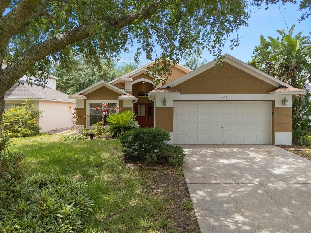 Photo of 1048 Woodsong Way, Clermont, FL 34714 (MLS # O6322802)