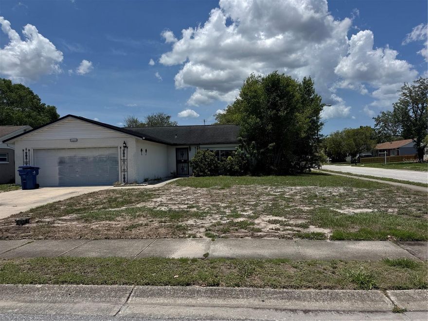 CALLING ALL INVESTORS! HANDYMAN. GREAT LOCATION ON A CORNER LOT. 2/2/2 spacious floor plan. BIG LANAI. 2013 ROOF. Seller has NO KNOWLEDGE of the homes mechanicals. DON'T MISS OUT ON THIS INVESTMENT OPPORTUNITY. GREAT AREA TO OWN A RENTAL. TRINITY ZIP CODE ZONED FOR A RATED SCHOOLS. NO HOA. NO RENTAL RESTRICTIONS. PROBATE HOME.