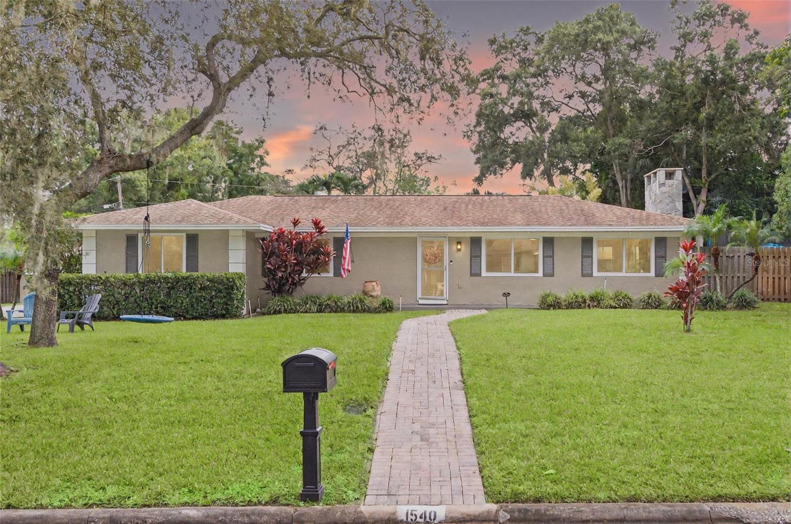 One or more photo(s) has been virtually staged. Come see this amazing home on 2 lots in the desirable Clearwater neighborhood of Glenwood! With more than 1/4 acre of land in a Non-Evacuation zone, no flood insurance required and no HOA. This 3 bed 2 bath, 2 car garage home is ready for you to move right in. Upon walking in you will feel right at home with the open floor plan which includes plenty of spaces to create a cozy nook or office around the wood burning fireplace. The bedrooms are nicely sized and primary bedroom includes an ensuite bath. The large family room in the rear offers many opportunities as a perfect flex space for play room, family space, man cave or more! Recent updates include NEW Impact Rated Windows, NEW updated electrical and panel, A/C in the garage, an 8x8 office outfitted in the garage, NEW whole home water filtration system and under sink RO by Purity Bay, irrigation on well, new sod, new fencing, new pavered patio and more! Roof is about 10 years and A/C is about 6 years. Don't miss out on this amazing opportunity!