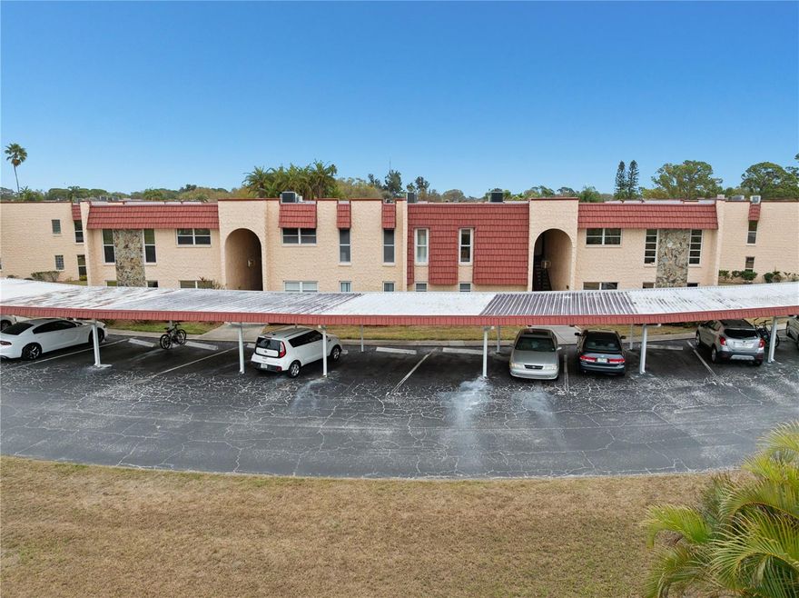 Welcome to The Gardens, one of Seminole’s most desirable 55+ communities, known for its peaceful, park-like setting and prime location near Lake Seminole Park.

This freshly painted corner-unit, ground-floor 3-bedroom, 2-bath residence offers generous living space, added privacy, and exceptional flexibility. The oversized living area is currently arranged with a full dining set, showcasing the scale of the room, yet can easily function as an expansive living space. A separate dining area adjacent to the kitchen accommodates a full six-seat table, providing multiple layout options.

The kitchen overlooks the main living area over a breakfast bar, creating an open, connected feel. The layout presents exciting potential to transform the space into a dream chef-style kitchen by opening the center bar wall and incorporating a large island design, similar to other beautifully renovated units within the community.

The spacious primary suite offers a large bedroom, walk-in closet, and an oversized primary bathroom featuring dual sinks and a step-in shower. The second bathroom includes a tub, providing the convenience of both options for those who prefer a walk-in shower or relaxing bath.

A water heater was installed in January 2026. The screened rear door provides convenient access toward the heated pool and clubhouse just moments away.

This unit includes two covered carports, a valuable and uncommon feature within The Gardens, as not all units offer dual covered parking.

Residents enjoy biking and walking along the waterways and landscaped grounds with direct access to adjacent Lake Seminole Park. Just minutes away is The Seminole City Center, an outdoor shopping and dining destination featuring restaurants, boutiques, major retailers, and a dine-in movie theater. On the first Friday of each month, the City Center hosts live music for dancing and socializing.

The City of Seminole also offers a public library and a community recreation center with affordable memberships that include exercise classes, art classes, and social events.

Community amenities include a heated pool, clubhouse, shuffleboard courts, and beautifully maintained grounds. Approximately 10 minutes to Madeira Beach and the Gulf beaches.

Priced competitively, this home offers an excellent opportunity to update and build equity, as renovated units within The Gardens have achieved higher sale prices.

Whether full-time or seasonal, this corner-unit, ground-floor residence delivers space, privacy, convenience, and strong value potential in one of Seminole’s most convenient 55+ communities.