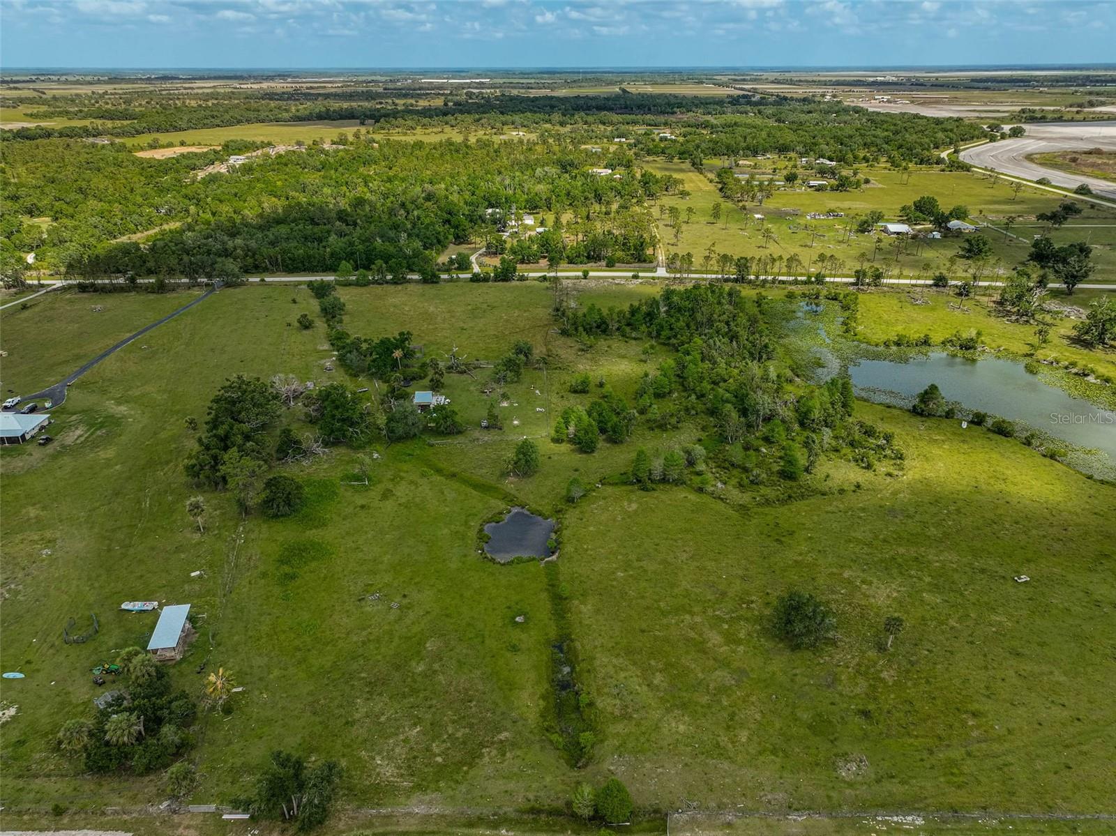 Are you ready to transform your dreams into reality in the breathtaking expanse of country living? This incredible 10-acre parcel of land awaits your vision! Picture a tranquil pond glistening in the sunset, offering you not just beauty, but endless possibilities. Fully fenced and perfect for livestock, this property comes with a spacious pole barn, ready for all your hobbies and projects. Imagine the life you could create here: a custom dream home, a thriving self-sufficient homestead, or a peaceful retreat away from the hustle and bustle. The absence of HOA restrictions means you can choose your own builder and take your time crafting the lifestyle you’ve always wanted. Relish in the stunning sunrises and sunsets while discovering the myriad of opportunities this land offers. Plus, with mineral rights included, this property represents not just a home, but an investment in your future. Could this be the place where your next chapter begins? Don’t let this extraordinary opportunity pass you by—schedule your showing today and embark on your journey to the serene country life you deserve!