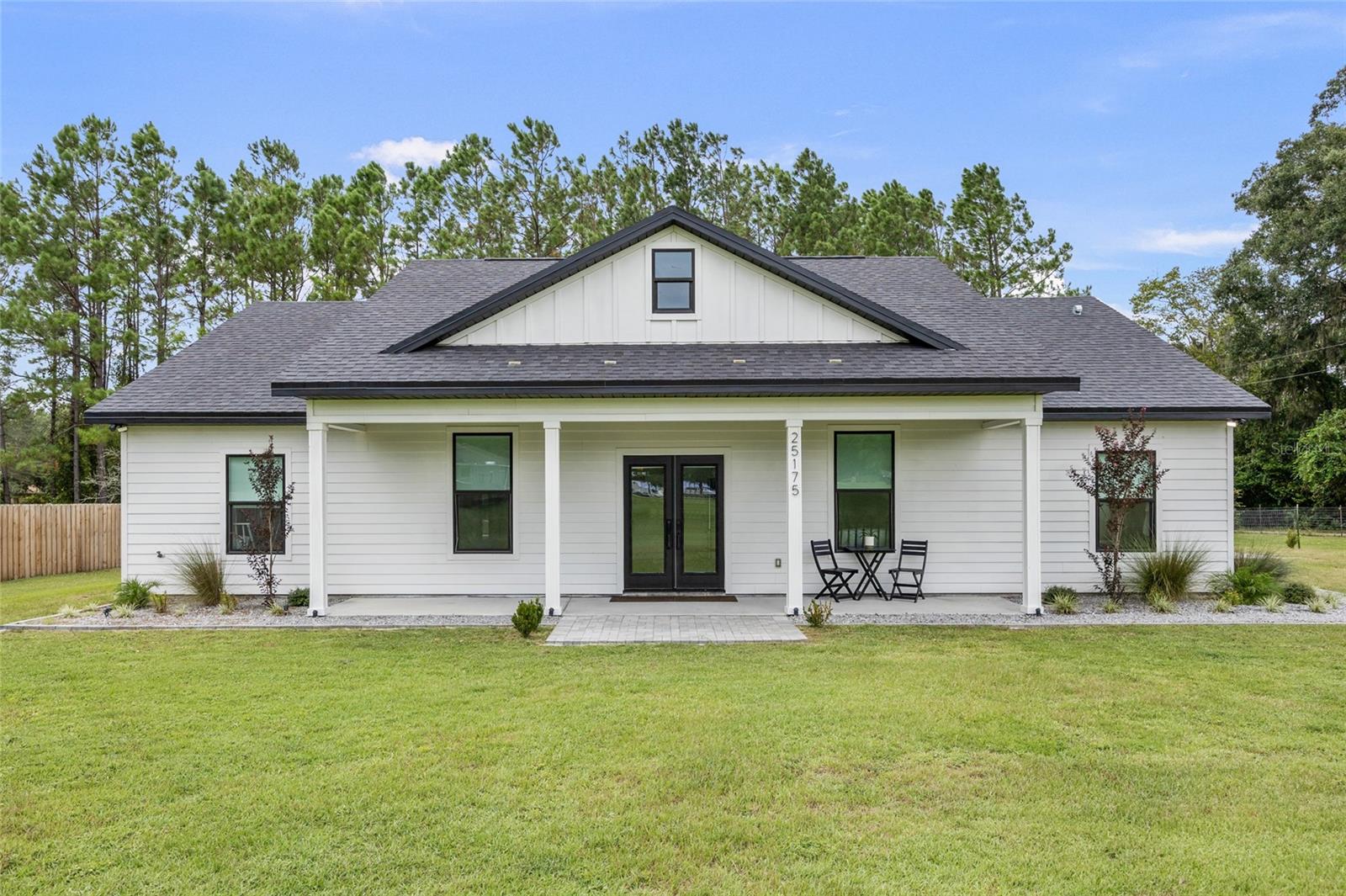 NO HOA or DEED RESTRICTIONS & BETTER THAN NEW 3 bed 2 bath home set off the highway on just under a half acre lot conveniently located between High Springs and Newberry. The open floor plan features exquisite lighting and bath finishes, 10' ceilings in living area and 9' ceilings throughout rest of home, large 2-car garage, quartz countertops, white shaker cabinets, luxury vinyl plank flooring throughout, trey ceiling in the master & more! The luxury master boasts a HUGE walk-in closet, dual vanities, separate shower and freestanding soaking tub. The screened lanai overlooks the fenced backyard which borders a large tree farm.
