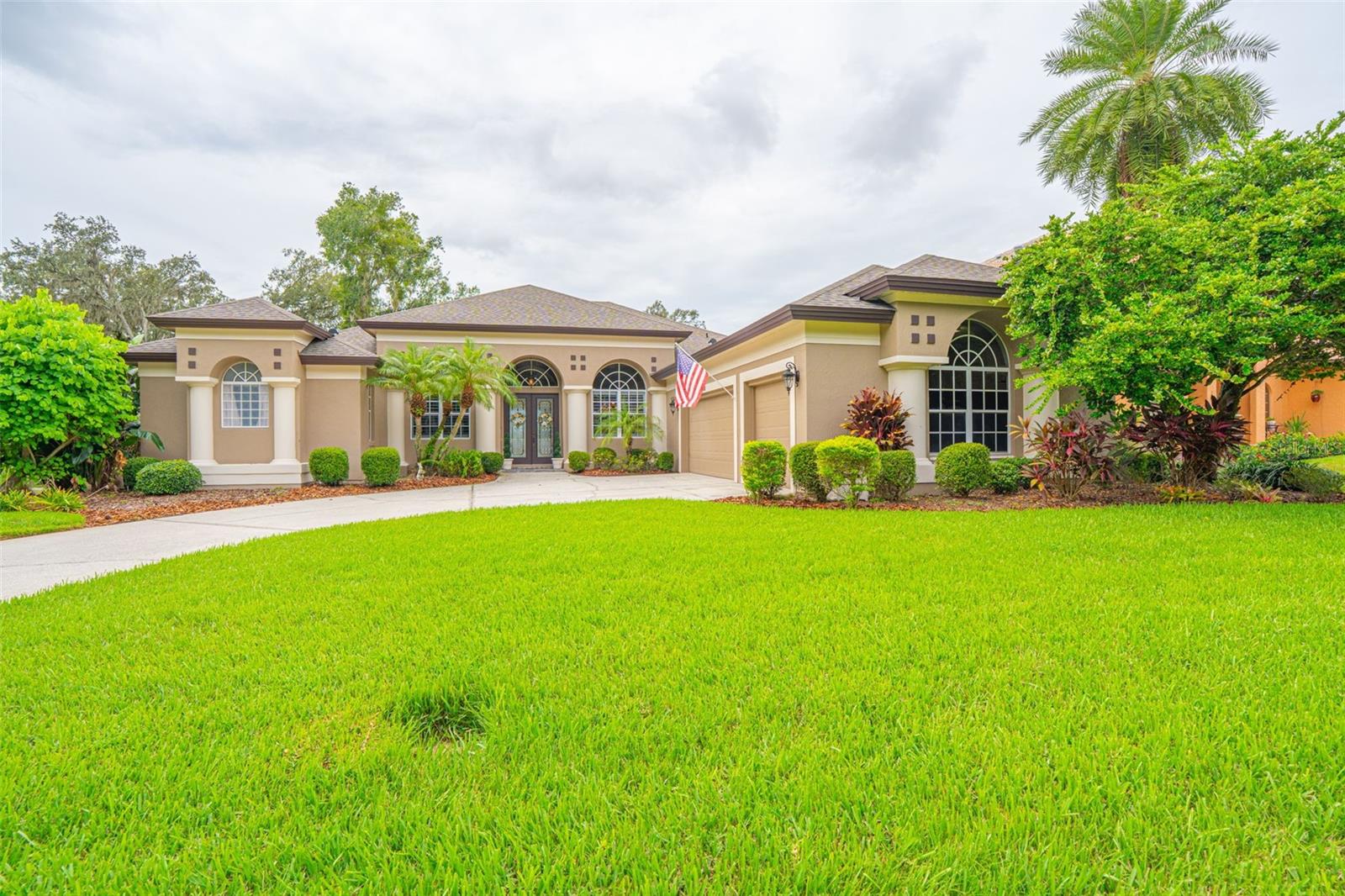 Prepare to be amazed by the breathtaking panoramic views from this beautifully upgraded, custom-built home that is truly one of a kind in the area. With over $80,000 in recent upgrades and renovations, this property offers luxury living at its finest. Designed with a desirable split floor plan, the home features a spacious primary suite with a beautifully remodeled en-suite bathroom and a private den or office. On the opposite side, enjoy formal living and dining spaces, plus a large, light-filled family room with stunning picture windows showcasing the expansive water view. The remodeled kitchen boasts modern finishes, updated appliances, and a cozy breakfast nook, perfect for enjoying the serene views. Open the triple-pocket sliding glass doors and extend your living space onto the large, covered lanai with a screened pool and spa. Enjoy the convenience of a prime location close to shopping, dining, and major interstates, all while surrounded by natural beauty and peaceful water views. Whether you’re relaxing by the pool or watching the local wildlife from your lanai, this home is a rare find that seamlessly blends comfort, style, and serenity. List of upgrades include: 2020 High-efficiency variable speed HVAC system, 2022 New roof, 2022 Two new water heaters, 2022 Remodeled kitchen with all new appliances, 2022 Pool resurfaced with new pump and updated lighting, 2022 Interior and exterior full-house paint, 2023 Plantation shutters (front-facing windows), 2024 Attic insulation upgraded to R-38, 2024 Additional hose spigot added to lanai, 2025 Three new double-pane picture windows in the family room