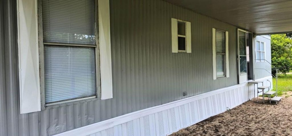 Photo of 221 Sunshine Boulevard, Polk City, FL 33868 (MLS # O6369712)