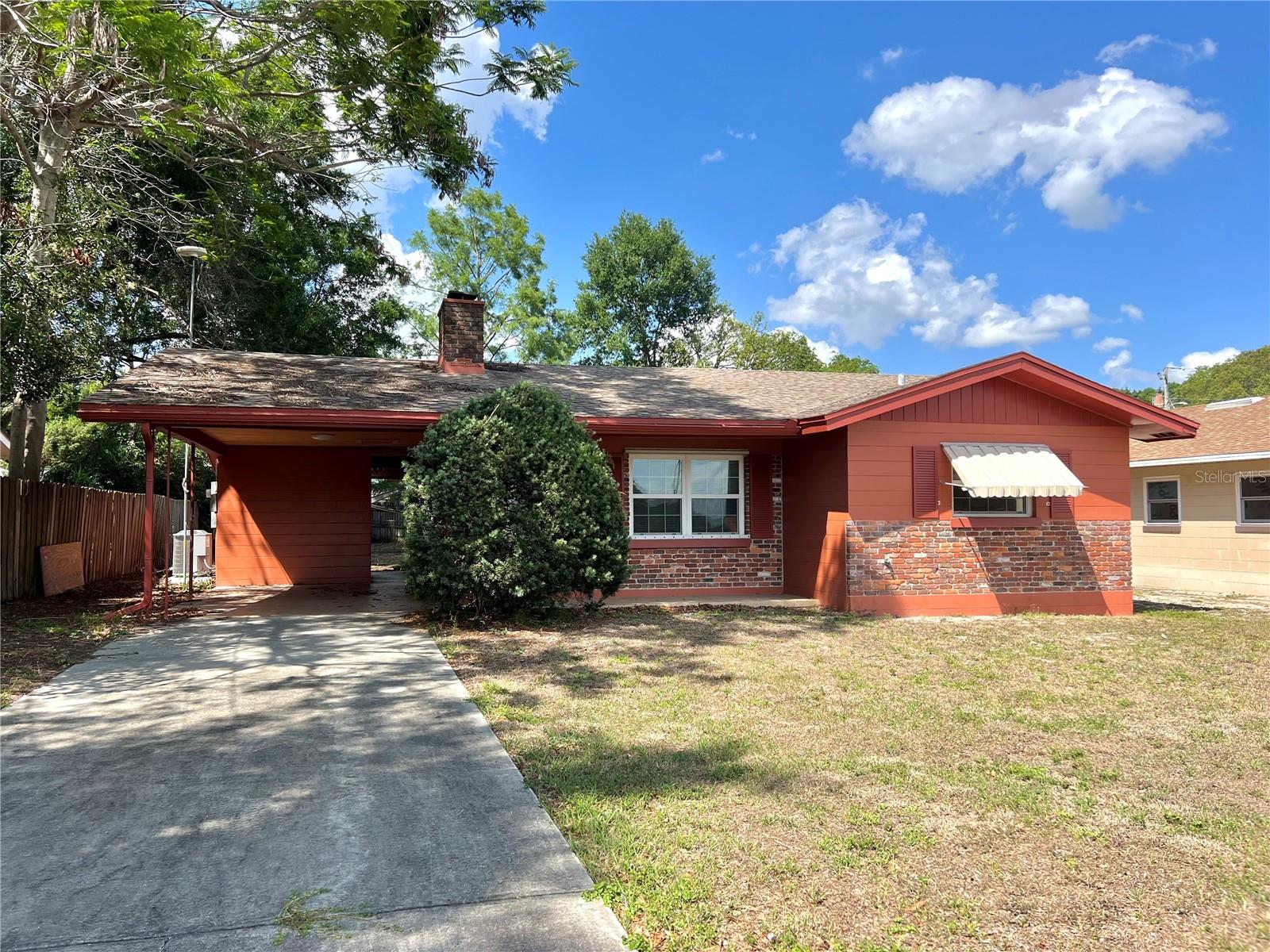 A Real Charmer that would be perfect for starting up or slowing down! Features spacious living room w/ fireplace, remodeled kitchen w/ new cabinets and countertops, bonus room addition that could be den/family room, office or possibly 3rd Bedroom. Hall bathroom has new vanity cabinet and countertop and fairly new tile in the tub/shower combo. Master bathroom has step-in shower and pedestal sink. Additionally the home features a carport w/ a laundry room behind it, plus covered storage area, large back yard, and fairly new roof and windows. Central heat & air is only 2 years old! Home is located on a quiet street in a fabulous neighborhood in the SE Winter Haven.