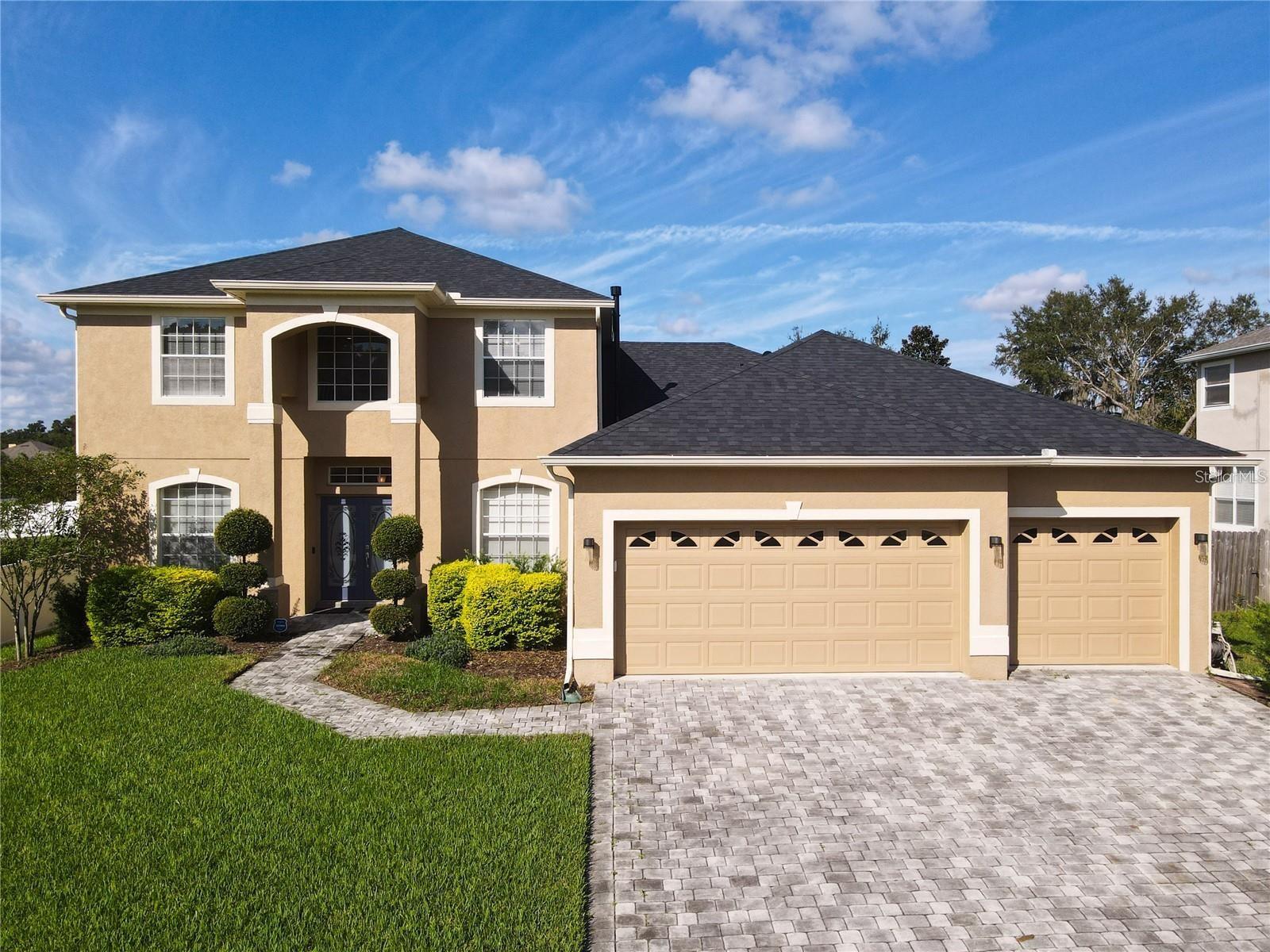 Welcome to 220 Blue Crystal Dr Deland featuring over 3,100sqft.of living space. This home offers a perfect blend of space, comfort, convenience and updates. Why settle for less when you can have it all. Roof 2023, Interior/Exterior Paint 2021. This property features 5 bedrooms, 3 full baths, along with a Loft and Three-Car Garage. Large Family room with Separate Formal Living and Dining Room. Open Kitchen area overlooking the Family room. The Kitchen features New Quartz Countertops, 42 inch Cabinets with Crown Molding. Chefs delight with Gas Range and updated Stainless-Steel Appliance 2020, Closet Pantry features custom built in storage 2020. Main Floor Master Suite Bedroom is large with lots of natural light. You’ll be impressed with the Large Master Walk-in Closet with custom storage 2023. Additional closets also feature custom storage to maximize your space. Master Bath includes two vanities, dual sinks, garden tub, and a separate shower. You’ll find an additional Bedroom and a fully updated Bathroom downstairs for guests to enjoy. An inside laundry room is conveniently located on the main floor and features a new laundry sink. Upstairs features a versatile Loft area which provides additional living space. Three Bedrooms and a Full Bath are also located upstairs. All bedrooms except one feature large walk-in closets. Enjoy the large patio out back on the oversized yard. Additional features, New (1) HVAC 2024, New Landscaping 2021, Separate Meter for Irrigation system, Paver Driveway, New Plug for Generator, New Carpet 2020, Water Softener 2023. The home is situated just minutes from Historic Downtown Deland, shopping, restaurants, I-4, the hospital, schools, parks, and walking trails.