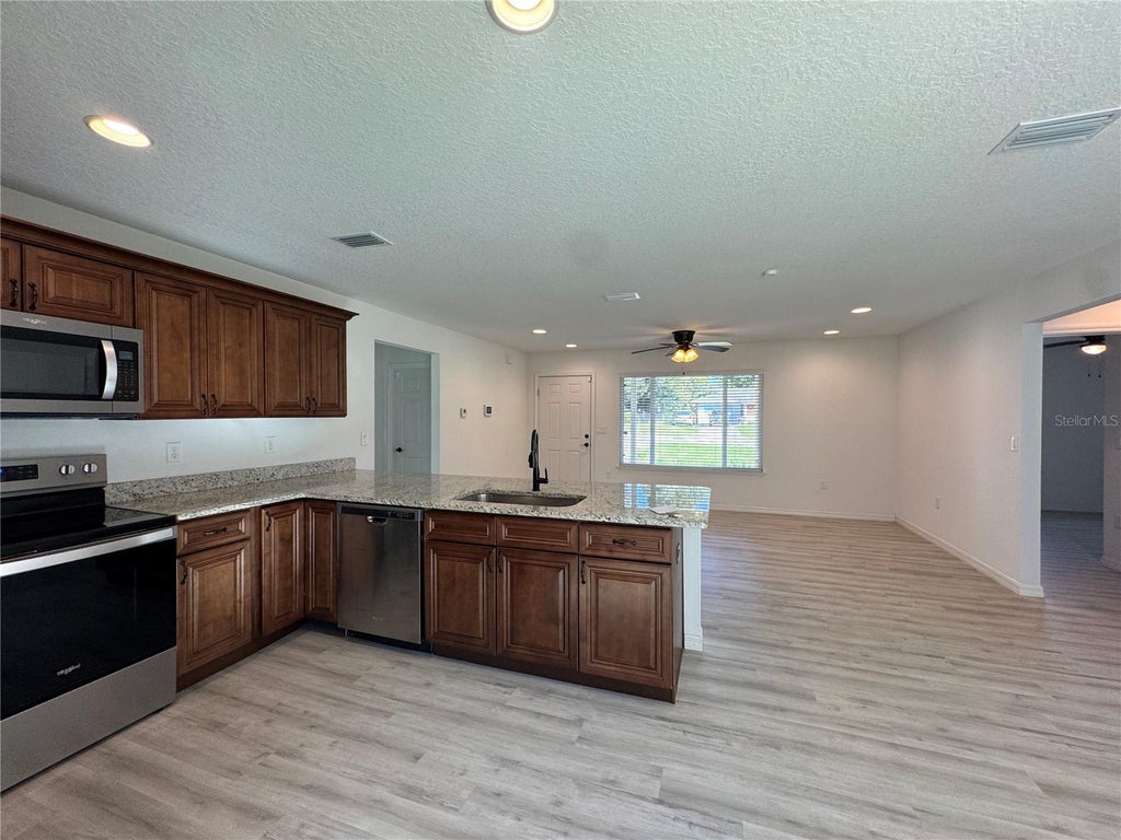 Photo of 21046 SW Peach Blossom Street, Dunnellon, FL 34431 (MLS # OM734559)