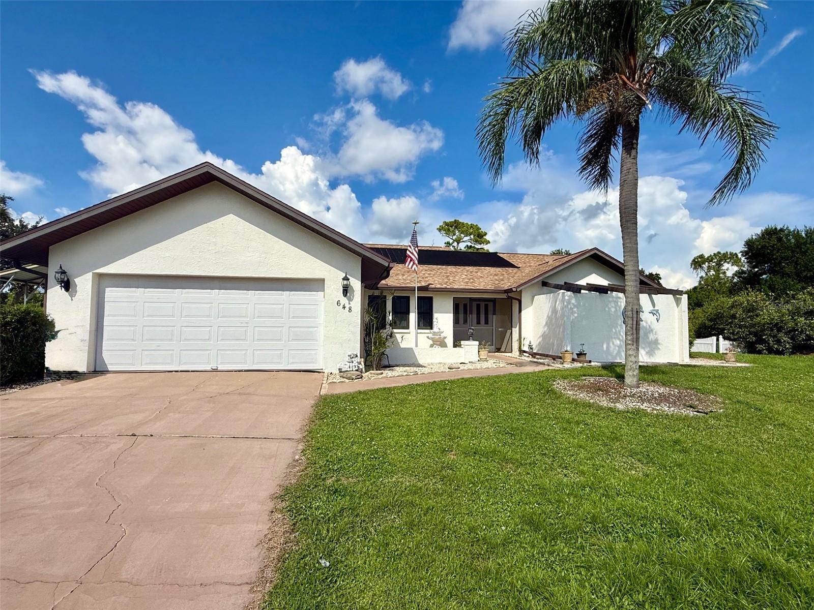 Stunning Updated Pool Home – Move-In Ready! Beautifully updated 3-bedroom, 2-bath home designed for comfort and style. Features include an open floor plan, hardwood floors throughout, gourmet kitchen with stainless steel appliances & ebony granite, plus a sleek built-in electric fireplace. Enjoy serene pool views from nearly every room! Entertain on the oversized paver lanai with outdoor sink area, or relax in the spa-like primary suite with jetted tub and private garden retreat. Guest room includes a custom Murphy bed. Added perks: accordion hurricane shutters, impact windows, 2 storage sheds, covered RV/boat carport, and 2-car garage—all outside the flood zone.
Move-in ready, this home is a true Florida oasis!