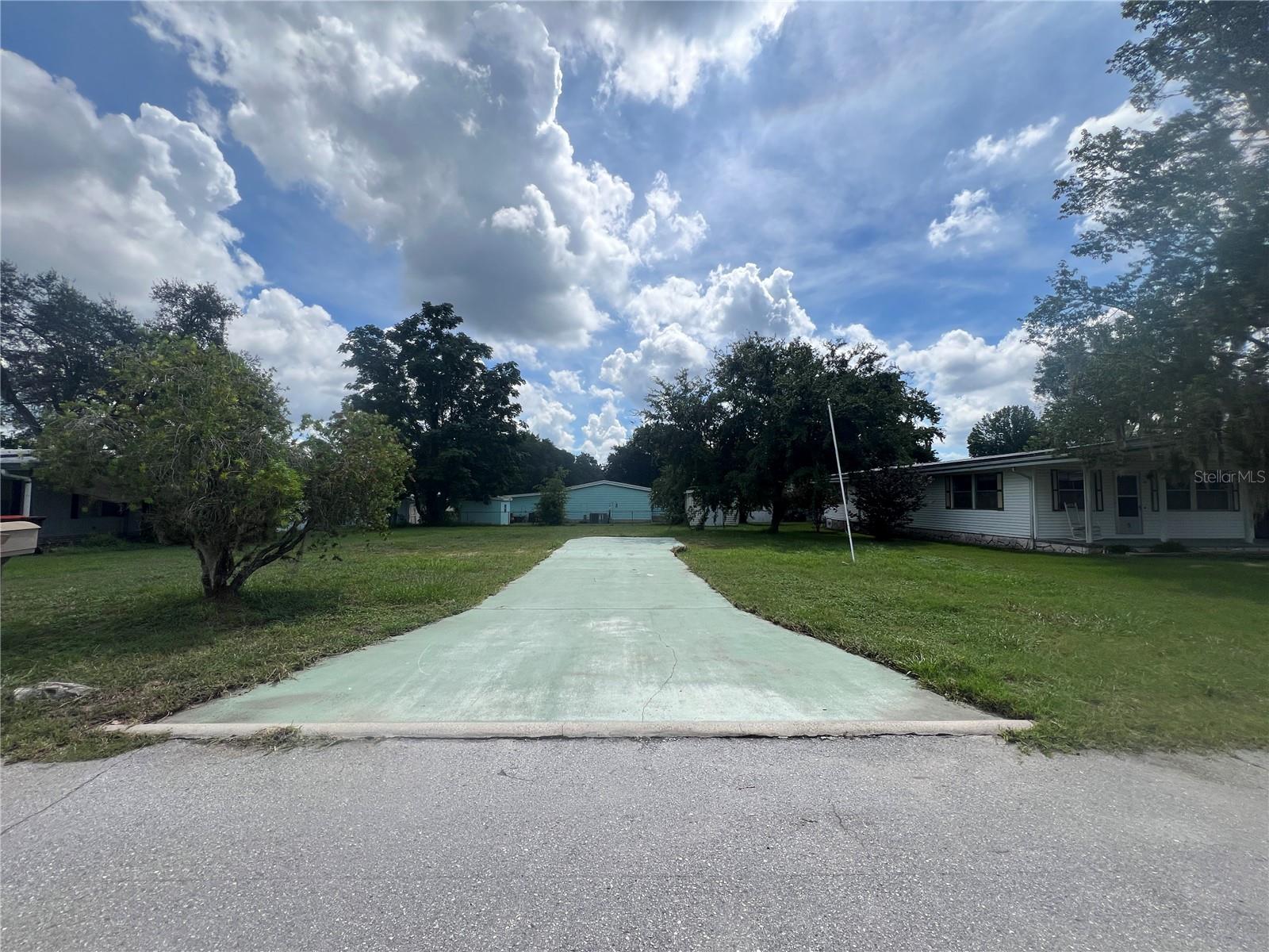 Look no further - build your dream home in Ocala East Villas! Here's a fantastic opportunity to own your own piece of Florida paradise—no flood zone, no lot rent, and a low all-ages HOA! This spacious 0.17-acre cleared lot is zoned R4 and ready for your new mobile home. Located just a short walk from the community clubhouse, pool, and amenities, you'll enjoy convenient access to everything the Ocala East Villas has to offer. HOA fees include water, sewer, trash, access to the clubhouse, pool, fitness center, shuffleboard court, and even RV parking. Electric is already on-site for easy setup, and no environmental impact fees apply. Ideally situated close to downtown Ocala, with shopping, dining, and entertainment nearby, plus access to a variety of outdoor activities including boating, fishing, hunting, kayaking, trails, and more. Don’t miss out on this fantastic opportunity—schedule your visit today!