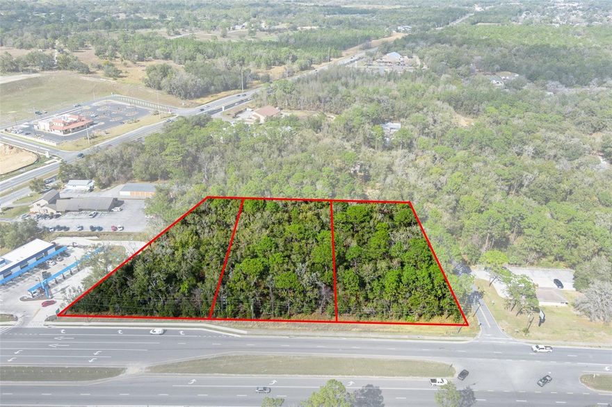 This prime multi-parcel land development opportunity is located in the Central Ridge District of Citrus County, Florida, strategically positioned within the region’s largest national retail hub expansion. Surrounded by major retailers such as Target, ALDI, Walmart, McDonald’s, Panda Express, Texas Roadhouse, Panera, and Starbucks, the site benefits from strong retail synergy and high consumer traffic, making it an attractive investment for commercial developers. 

The property consists of three parcels totaling 3.57 acres: Lot 19 (1.24 acres, 150’ x 350’ corner lot), Lot 20 (1.24 acres, 150’ x 350’), and Lot 21 (1.09 acres, 215’ x 350’). It has direct access to county utilities, including sewer, and is zoned under the PSO Commercial district (Citrus County Ch. 2 LDC), allowing for 70% lot coverage and a variety of permitted uses such as professional and medical offices, emergency rooms, regional hospitals, retail, dine-in and drive-thru restaurants, hospitality, pharmacies, medical marijuana treatment centers, assisted living facilities, and multifamily developments of up to 10 units per acre.

Located at the northwest corner of CR 486/W Norvell Bryant Hwy and N Crookedbranch Drive, the property offers over 510 feet of prime frontage with full ingress and egress via a median cut, ensuring seamless traffic flow and high visibility. It is just two parcels from the major intersection of CR 486 and CR 491, providing direct access to key regional traffic patterns and national retail clustering. Within a five-mile radius, the property is surrounded by premier residential communities, including Black Diamond Ranch, Citrus Hills, and Terra Vista, featuring a PGA-rated golf course and the highest residential density in a single community. 

The area serves a consumer population of 66,966 residents within a 15-minute drive, with a median age of 60, reflecting strong demand for retail, services, and medical facilities. Citrus County is part of the Tampa–St. Petersburg–Clearwater MSA, the 18th largest metro area in the U.S., and is experiencing rapid growth. The population is projected to increase from 153,600 to 350,000 by 2030, driving demand for residential and commercial development. The $135 million Suncoast Parkway expansion further enhances accessibility, solidifying Citrus County as a gateway to the Tampa Bay region. 

Within a 15-minute drive, the property serves 46,361 residents with an average age of 58 and a median household income of $65,000, making it well-positioned for commercial success. With its prime location, zoning flexibility, and strong market potential, this property presents an exceptional opportunity for developers to capitalize on Citrus County’s dynamic growth.

Disclaimer: All information provided herein is for marketing purposes only and is not guaranteed for accuracy. Prospective buyers or tenants are encouraged to conduct their own independent due diligence. The seller, broker, and associated parties make no representations or warranties, expressed or implied, as to the accuracy or completeness of this information. All dimensions, zoning details, financial data, and other property-related facts should be independently verified. Please consult with appropriate licensed professionals before making any investment or purchasing decisions.