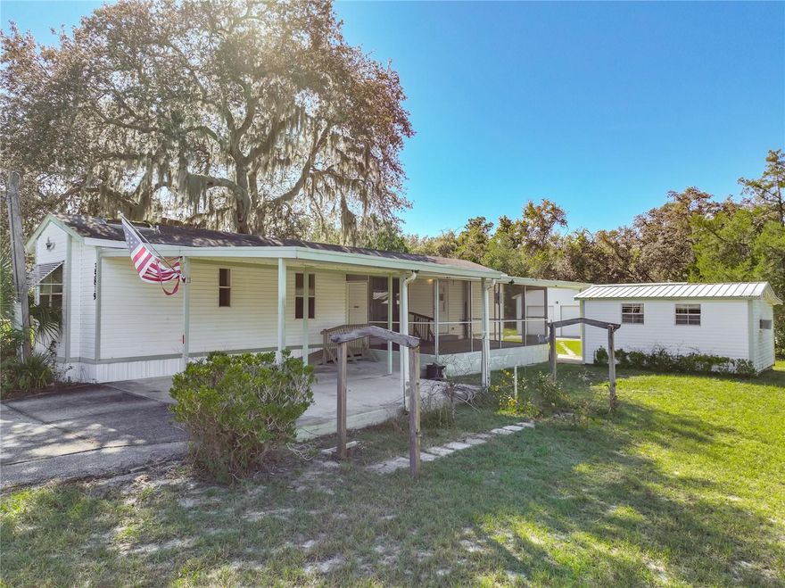 Peaceful Country Living with a Dream Workshop. Welcome to 35819 S. Shelley Drive a Charming 2- bedroom, 2-bathroom Manufactured home built in 1995, Set on a generous 1/2-Acre lot, fully Fenced Yard for both privacy and Space. This property is perfect for anyone Seeking Freedom from no HOA Restrictions and Not in a Flood zone. The Real Star of this Magnificent property is the massive, detached Workshop. Offering a metal roof and Double garage doors with a separate driveway, leading to your Oasis and private back yard. There is also an enclosed building for laundry room and lots of storage. Step inside the main Mobile home to find a comfortable Floor plan that is ready for your personal touch. Located in a peaceful pocket of Leesburg. You will enjoy easy access to Lake Harris, Venetian Gardens and Downtown Mount Dora, all just a short drive away. Plus, Orlando's theme park, Shopping and Entertainment. Whether you'll looking for a quiet primary residence or a weekend retreat close to Central Florida's Top Attractions, This property delivers the best of both worlds.