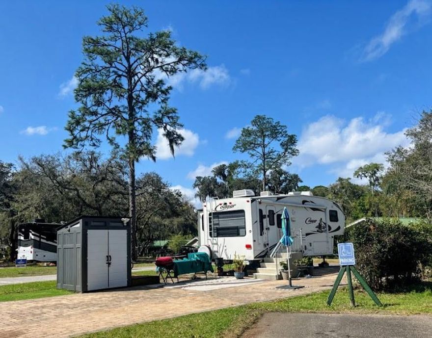 .. COME ENJOY THE EASY LIVING AT THE SALT SPRINGS RESORT ELITE! DEEDED PULL THRU LOT - COMPLETE PACKAGE DEAL - Salt Springs Resort has its own boat launch into little Lake Kerr and connects to big Lake Kerr for the fishermen or water activities! Not to mention all the nearby trails for hiking and adventure! Take a day trip and head to the beach, Daytona beach est. 45mins away!  Make this your weekend getaway or permanent home. Better yet Airbnb to make some extra cash. Only 40 minutes from Ocala FL & 23 miles to Palatka FL.. At the end of the day enjoy a swim in the 2 huge pools or shoot some horseshoes, play pickleball or basketball. This resort offers plenty of amenities that will keep you busy. The 2011 Cougar unit will remain on the  property.