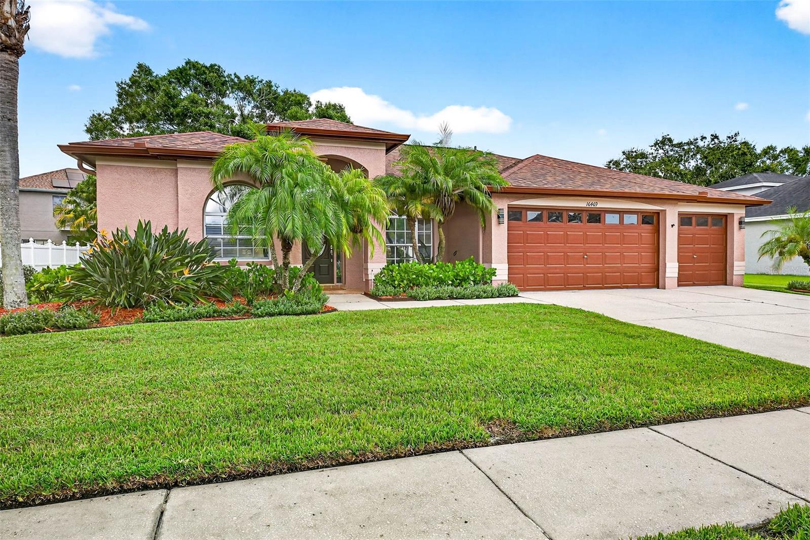 Welcome home to the Eagles located in Odessa, FL! A tranquil 24-HOUR GUARD-GATED community, featuring TWO 18-HOLE GOLF COURSES, that is situated on over 1000 acres of lush landscape. It’s truly the perfect blend of nature and luxury. This 2136-square foot home includes 4 bedrooms, 3 baths, and a 3-car garage. Upon entry, you’ll discover a generously sized formal living and dining space that flows effortlessly into the kitchen and family room area where you will enjoy views of the huge backyard with plenty of room for a pool. The kitchen offers GRANITE COUNTERTOPS, a BREAKFAST BAR, an EAT-IN SPACE, and a CLOSET PANTRY. The Primary Suite includes a WALK-IN CLOSET and an UPDATED PRIMARY BATH with a separate tub and shower. Newer systems include: ROOF (2023). AC (2024). Water Heater (2021). As a resident of the Eagles, you will enjoy miles of sidewalks for exercising as well as a community park that includes TWO CLAY TENNIS COURTS, a full-size BASKETBALL COURT, PLAYGROUND equipment and a pavilion with bathrooms. Convenient to ample restaurant and retail establishments, the Veteran’s Expressway, Tampa International Airport, the Westshore Business District, and the Pinellas County Beaches. Zoned for top-rated Mary Bryant Elementary, Farnell Middle and Sickles High schools. **Priced below recent appraisal.**