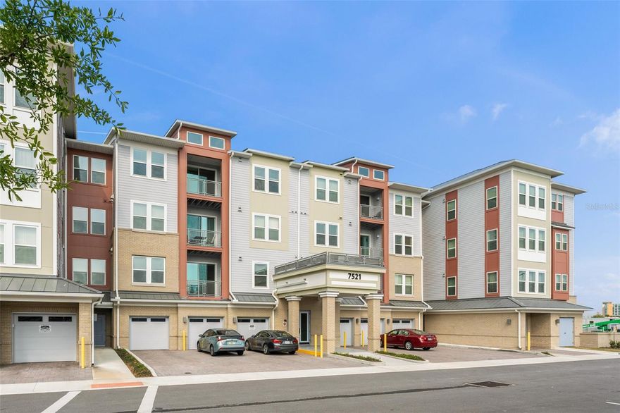 Exceptional opportunity to own a fully furnished condominium in the prestigious Gatherings of Lake Nona, a 55+ luxury community offering resort-style amenities including a sparkling pool, pickleball courts, a state-of-the-art fitness center, and a vibrant clubhouse. Ideally located within walking distance of Lake Nona Town Center, residents enjoy easy access to boutique shopping, diverse dining, and year-round events. Built in 2024, this nearly-new third-floor residence is easily accessible via elevator and features an open-concept layout connecting the kitchen, dining, and living areas, creating a bright and welcoming space perfect for everyday living or entertaining. The kitchen showcases solid wood cabinetry, sleek quartz countertops, and stainless steel appliances, while the spacious living room opens to a private balcony overlooking the community. The generous primary suite comfortably accommodates a king-sized bed and includes dual walk-in closets and a well-appointed en-suite bathroom with a dual vanity, private water closet, and glass-enclosed shower. A guest bedroom with a walk-in closet and a nearby full bathroom with a shower/tub combination provide comfortable accommodations for visitors. Additional highlights include a one-car garage with driveway parking and a prime location in the heart of Lake Nona with convenient access to SR 417, Medical City, and Orlando International Airport.