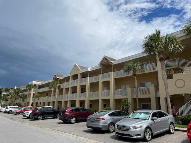 Welcome to Paradise. This 2BR/2BA condo has vaulted ceilings and is located in the gated Paradise, close to Arbor Lake. All appliances included. The kitchen has extra storage. There is a stacked washer/dryer in the unit. Extra large kitchen with extra storage, stainless steel appliances. Ceramic tile through out. All room sizes, floor plans and square footage are approximate. Association approval is required. On Top of the World has two activity centers, and two private golf courses with 9 and 18 holes, free for the exclusive use of resident owners. There are two swimming pools; one is heated. The newly remodeled Cardio Gym is equipped with up to date exercise machines. There are numerous hobby studios, a dog park and other amenities for the exclusive use of the residents. The many indoor activities include fitness classes, dancing, clubs, cards, billiards, entertainment, classes, and much more. The on-site "Good Karma Café," located in the East Activity Center is self-serve with take-and-bake meals and snacks.