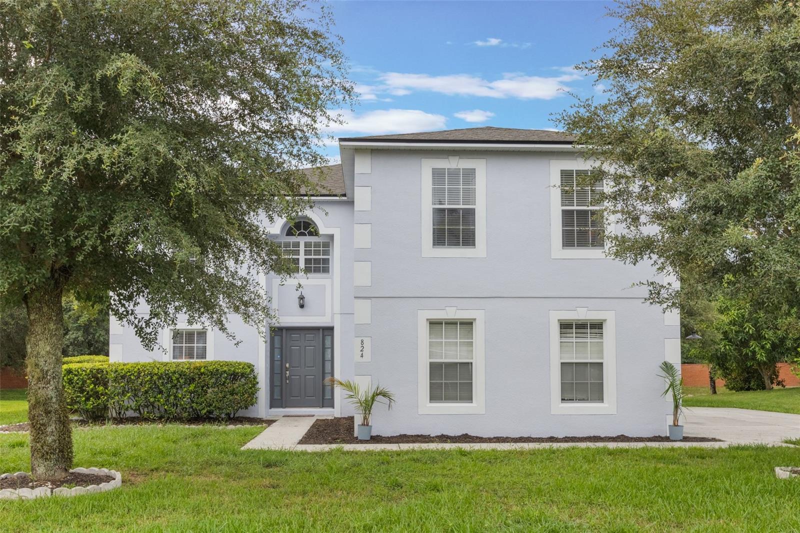 This well-kept home proves that smart layout, solid care, and a great location are what matters most. Tucked away in a quiet, established community shaded by mature oaks, it offers the perfect blend of flexibility and everyday convenience – all with low HOA fees. Step inside and you will find a clean, move-in ready space with room to grow. The original owners have lovingly maintained and thoughtfully updated this home, and are now downsizing. It is ready for its next chapter. The LAYOUT is ideal for those who crave flexible space; DOWNSTAIRS offers a versatile room that works nicely as an office, guest space, or fifth bedroom, a half bath, dining room/living room, laundry, family room, eating area and a kitchen. UPSTAIRS, 4 bedrooms, two full baths, and a generous loft with Travertine floors throughout, complete the upper level, offering plenty of room for family or guests. New Roof (2023), freshly painted exterior and partial interior (5/25), stylish new lighting, new Google Nest Learning Thermostat.
The heart of the home, the KITCHEN, was beautifully renovated in 2020, with new cabinets, granite countertops, updated appliances, a center island, and two walk-in pantries. Whether you are cooking for two or a crowd, this space just works. A window over the sink frames a peaceful view of the tree-lined retention pond – no rear neighbors, just quiet privacy. PRIMARY SUITE: Upstairs, the spacious primary bedroom is a standout, offering room to accommodate a sitting area, office space, or home workout area. Bath: is impressive and modern with a roomy, spa-inspired shower with its 2 rainfall shower heads and sitting bench. Closet: Large L-shaped, walk-in closet complete with built-in shelving, shoe racks and accessory storage. In a time when many neighborhoods feel crowded, this community stands out with well-spaced homes that offer a true sense of privacy and separation. Minutes from shopping, dining, churches, major roads and activities. Apopka is one of Central Florida’s top destinations for outdoor recreation, with beautiful landsapes of lakes, springs and natural land areas to get away and explore the best of nature.