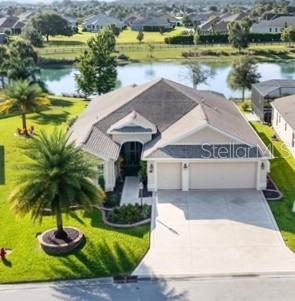 Beautiful WATERFRONT million dollar view the moment you cross the threshold of this magnificent Begonia DESIGNER HOME. Embrace the beauty of this oversized homesite as you drive up color coated driveway with 2 car garage along with a golf car garage. The home is enhanced with stacked pavers surrounding the easy care European landscaping and amazing butterfly garden. Home lightening rods have been added for peace of mind. Exquisite open floor plan after you enter through the enclosed screened porch. Prominent crown molding and cornices flow throughout the home along with luxury vinyl plank flooring and tile with enhanced tall ceilings. The stunning kitchen adjacent from your formal dining area, showcases beautiful wood cabinets with granite countertops, tile backsplash, peninsula bar and additional pantry storage. 2024 gas stove along with water filtration system enhances this amazing kitchen. This home is adorned with upscale finishes throughout including decorative lighting and fans, and impressive double stacking doors that open to your expansive climate controlled Florida room making this an impressive open concept area to entertain. Added in 2025 were the 3M privacy window film on lanai doors and MBR windows blocking 100%UV Rays, reflecting the owners commitment to quality. Head outside to your spacious screened lanai added in 2021, perfect for gathering with friends under the stars. Exceptional in every way is the brick patio with stunning railing making this resort style living while enjoying your amazing view and peaceful sounds of nature. When it's time to wind down for the night, indulge in your luxurious primary suite with a beautiful tray ceiling along with his/her custom walk-in closets. The En Suite boasts a ROMAN TILED SHOWER, and split vanities. The split floorplan, invites your guests to the two spacious bedrooms located near the front of the home each with built in closet cabinetry and a shared hall bath featuring a renovated walk in shower. Your laundry room is lined with cabinets before stepping into your amazing garage. Maple cabinetry with a workbench area, epoxy floors and insulated garage doors make this home complete along with the WHOLE HOUSE GENERAC GENERATOR ADDED IN 2022. In addition, in 2025, a Pegasus whole house filtration system with water softener was added. Elevating this home to the next level is the VERSALIFT ATTIC STORAGE SYSTEM with stairs, making organization a breeze. Love living in the sought after, VILLAGE OF FENNEY, lined with Spanish moss trees, several pristine walking trails, executive golf courses, pools, archery, Fenney Grill and nearby recreation center with numerous activities. Perfectly situated minutes from Brownwood Paddock Square and the new Eastport Town Square. This home is exceptional and can be yours today!