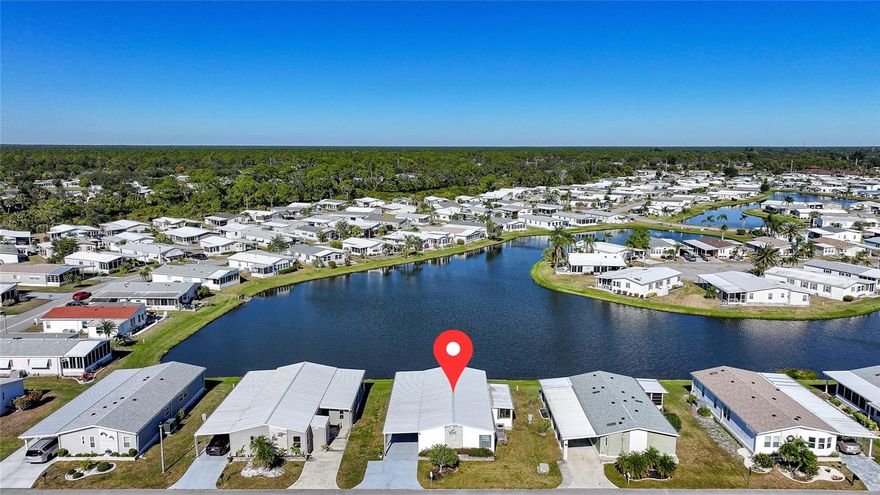 Lowest-priced waterfront property on the market. Updated, modern turnkey home offered furnished and move-in ready for immediate enjoyment. Perfectly situated on Lake Dolphin in the premier 55+ gated community of Harbor Isles. 2023 metal roof, 2023 Carport and Shed, 2022 A/C; offering peace of mind, durability, and long-term value. This home offers unobstructed, panoramic views of Lake Dolphin and is just 0.1 miles from the community boat ramp and kayak launch. The modern kitchen opens to a spacious living area ideal for entertaining, featuring an oversized island, new stainless steel appliances, a wall oven, and cooktop. The primary bedroom offers an ensuite updated bathroom and two walk-in closets, while the guest bedroom includes its own ensuite bathroom and walk-in closet, providing comfort and privacy for residents and guests. Spacious, long, and wide carport with plenty of parking, complemented by an oversized shed featuring a conveniently located washer and dryer. Harbor Isles is a premier, gated 55+ community situated along the scenic Myakka River, just minutes from the Gulf of America. LOW HOA $196 a month. NO LOT Rent. Residents enjoy an impressive array of amenities, including a heated pool and spa, state-of-the-art fitness center, tennis and pickleball courts, bocce and shuffleboard, an expansive clubhouse, library, and a marina offering boat and kayak access to the Gulf. This pet-friendly community features a vibrant social calendar with clubs and activities for every interest, making Harbor Isles the perfect place to enjoy an active and relaxed Florida lifestyle. There is plenty of wildlife to enjoy; herons, egrets, cranes, ibis, parrots, even alligators and manatees! Conveniently located within minutes of Downtown Wellen Park, Costco, shopping, restaurants, and a short drive to beautiful Gulf Beaches. Schedule a viewing today and make this dream home a reality!
