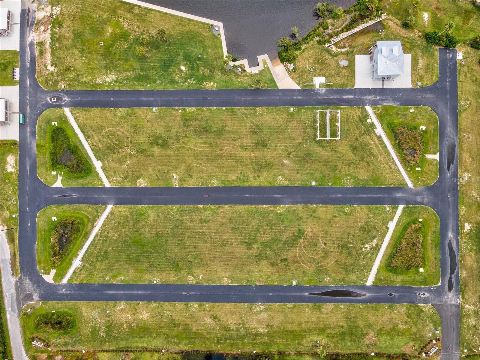Waterfront & Dock Potential
Deep-water canal connects directly to the Gulf of Mexico with approximately 20-minute boat ride to open water
Seller initiated construction with Dock, sea wall and boat ramp
Build-Ready Condition
Fully cleared, compact soil; includes existing survey, geotechnical report, and architectural home plans (available to buyer)
All utilities nearby: electricity, telephone, water, sewer; roads lit and paved up to the site
Location & Lifestyle
Nestled adjacent to Boy Scout Preserve with boardwalk trails — enjoy serene nature right out your doorstep
Just a minute’s walk to Robert K. Rees Memorial Park featuring sandy beaches, fishing piers, and stunning sunset views
Conveniently situated off US-19, near the revitalized downtown of New Port Richey with shopping, restaurants, entertainment
Financial Highlights
List Price: $39,500.00
Ideal Buyer Profile
This is a rare chance for discerning buyers—boaters, waterfront enthusiasts, or custom-home seekers—to build a private estate tailored to their vision, with turnkey waterfront potential in an exclusive gated setting.