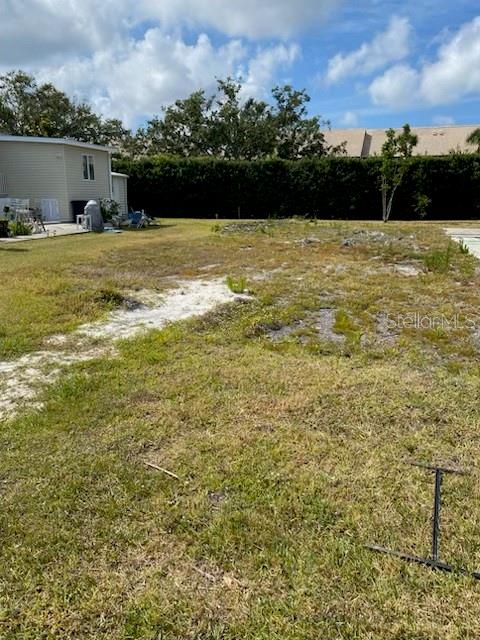Vacant Lot - home has been removed saving you several thousand dollars. Private hedge behind - design your dream home. Sandalwood is a much sought after community offering a heated pool, along with many many social opportunities. Close the historic downtown Venice and our beautiful beaches, as well as casual and fine dining, theater, art center, library and center for the performing arts. Venice has it all - affordable living at it's best. Sandalwood welcomes your furry friends and is building a new dog park - so don't wait, and if you need some help in the building process, I have experience putting new homes in and will be happy to help you through the process!