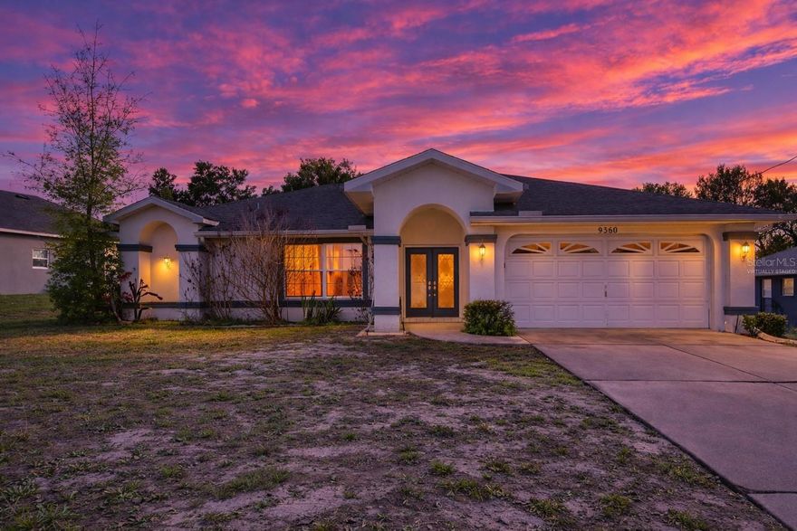 One or more photo(s) has been virtually staged. Three-bedroom, two-bath, two-car garage home situated on a 0.20-acre lot in beautiful Spring Hill, Florida. This well-designed split floor plan features 8-foot ceilings through-out and cathedral ceiling in the family room, an updated kitchen with solid surface cabinets and recessed lighting, and a functional layout ideal for everyday living. The home also includes an inside utility room and an oversized two-car garage offering additional storage and workspace. Enjoy outdoor living on the large rear porch, perfect for relaxing or entertaining. The property is serviced by an irrigation well, helping reduce monthly utility expenses. Conveniently located close to schools, shopping, and major highways, providing an easy commute to Ocala, Tampa, or St. Petersburg. Ideal opportunity for homeowners seeking space, convenience, and value in the heart of Spring Hill.