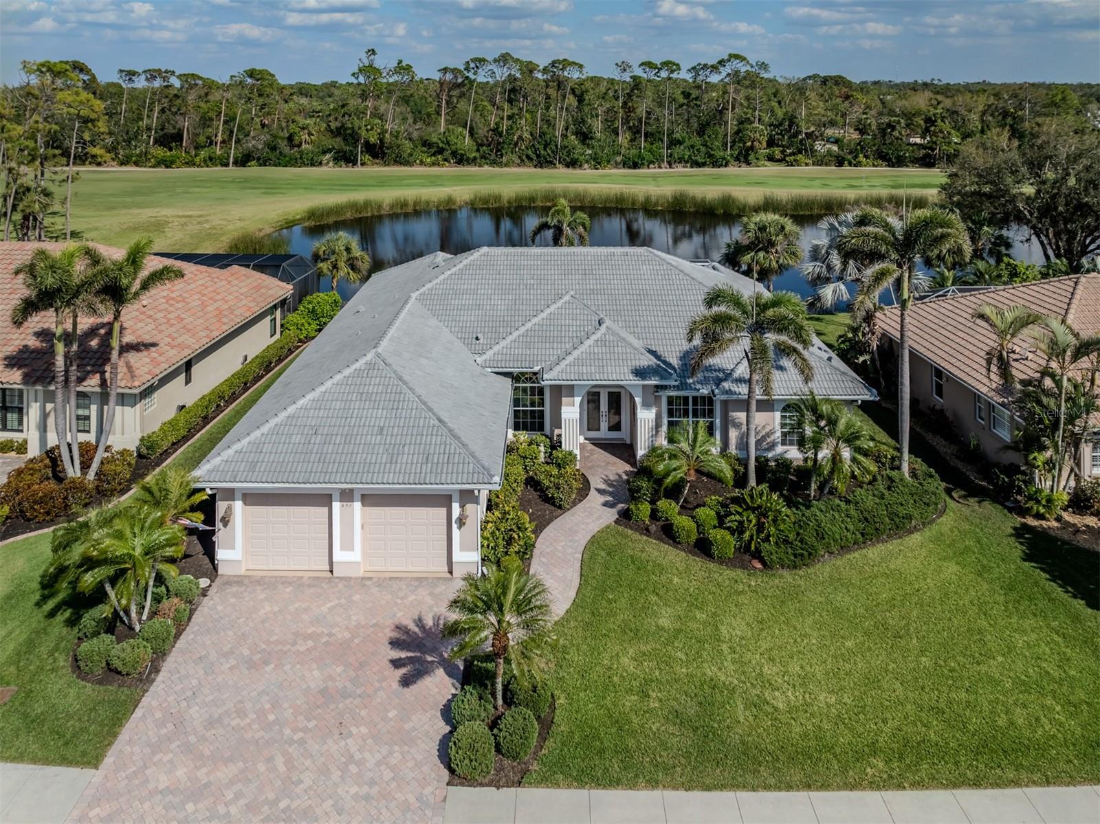 Premium lakefront location in desirable Sawgrass, one of Venice's highly sought-after golf communities! 3,200 sq.ft. comfortably houses the true 3 bedroom/3 full baths plus office all in a flowing open floorplan. The extra-size kitchen and "cafe' area" overlook the irresistible lake-side pool and caged lanai as well as the large family room. Here you'll find plenty of space for all to gather. Two of the sizable bedrooms and bath are in one wing of the home and the truly masterful primary suite is on the opposite side. One of the 3 baths conveniently has dedicated pool access. NOTICE THE BRAND-NEW TILE ROOF as of Feb. 2025, providing for extra value and many years of lifetime ahead. This great community has no CDD fees, optional 9-holes of golf, a large and sunshiny pool and resort-style lounging area, various fun sport activities and many social opportunities. Sawgrass is just 4 miles to Venice Island and all that it has to offer, from beaches to bistros to boutiques. This fine home was beloved by its previous owners and their family and new to the market, so be sure you don't miss the opportunity!
.