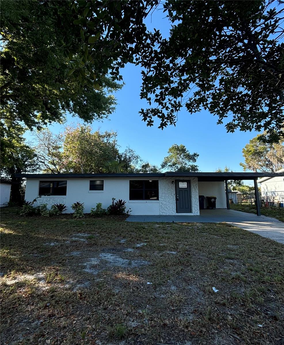 Charming Auburndale Home near Lake Ariana! In the heart of Auburndale, conveniently located from I-4, making commuting to Lakeland, Orlando and Tampa a breeze. This beautifully updated 4Bed/ 2 Full Bath home features a modern and sleek vibe, with its freshly updated exterior, and its newer wooden fence surrounding this 7,841 sqft lot, designed to give you security and the ultimate backyard privacy experience. Situated in a cul-de-sac with no-HOA, no CDD and just a few minutes away from Lake Ariana, Lake Stella and Lake Hart; parking your boat, rv, or any outside toys would be less of a concern. Inside, you'll find yourself a spacious floor plan of 1,824 sqft. Fully laminated floors welcome you throughout the home, with a very large family/ dining room combo that opens to an impressive kitchen. The kitchen showcases modern cabinetry, stone countertops with an abundant workspace, a glass cooktop with range hood, built-in microwave and oven, and a sleek stainless steel undermount sink. Not to mention, the light and bright subway tile backsplash that makes everything come together, kitchen so bright and clean it could almost feel like a dream! But not done there, this home boasts with a capacious master's suite with its own walk-in closet perfect for weekly shopping sprees. Both bathrooms are fully updated with modern vanities, ceramic floor tiles and a floor-to-ceiling tile wall. Containing a newer mini-split A/C system, take control of the temperature of each room with confidence in this Florida weather. This home blends comfort, convenience, style perfectly. Schedule your private tour today!