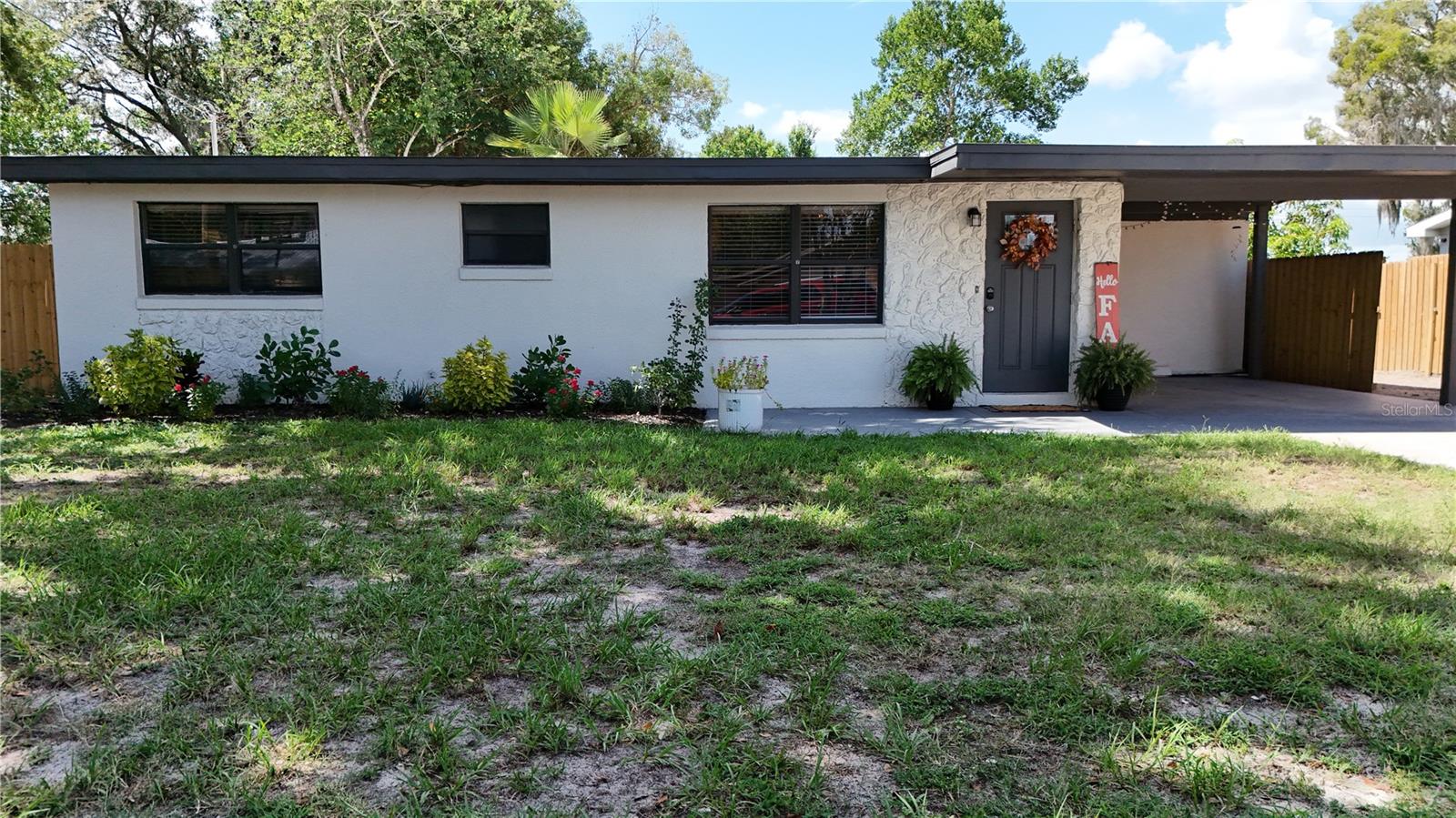 Charming Auburndale Home near Lake Ariana! In the heart of Auburndale, conveniently located from I-4, making commuting to Lakeland, Orlando and Tampa a breeze. This beautifully updated 4Bed/ 2 Full Bath home features a modern and sleek vibe, with its freshly updated exterior, and its newer wooden fence surrounding this 7,841 sqft lot, designed to give you security and the ultimate backyard privacy experience. Situated in a cul-de-sac with no-HOA, no CDD and just a few minutes away from Lake Ariana, Lake Stella and Lake Hart; parking your boat, rv, or any outside toys would be less of a concern. Inside, you'll find yourself a spacious floor plan of 1,824 sqft. Fully laminated floors welcome you throughout the home, with a very large family/ dining room combo that opens to an impressive kitchen. The kitchen showcases modern cabinetry, stone countertops with an abundant workspace, a glass cooktop with range hood, built-in microwave and oven, and a sleek stainless steel undermount sink. Not to mention, the light and bright subway tile backsplash that makes everything come together, kitchen so bright and clean it could almost feel like a dream! But not done there, this home boasts with a capacious master's suite with its own walk-in closet perfect for weekly shopping sprees. Both bathrooms are fully updated with modern vanities, ceramic floor tiles and a floor-to-ceiling tile wall. Containing a newer mini-split A/C system, take control of the temperature of each room with confidence in this Florida weather. This home blends comfort, convenience, style perfectly. Schedule your private tour today!