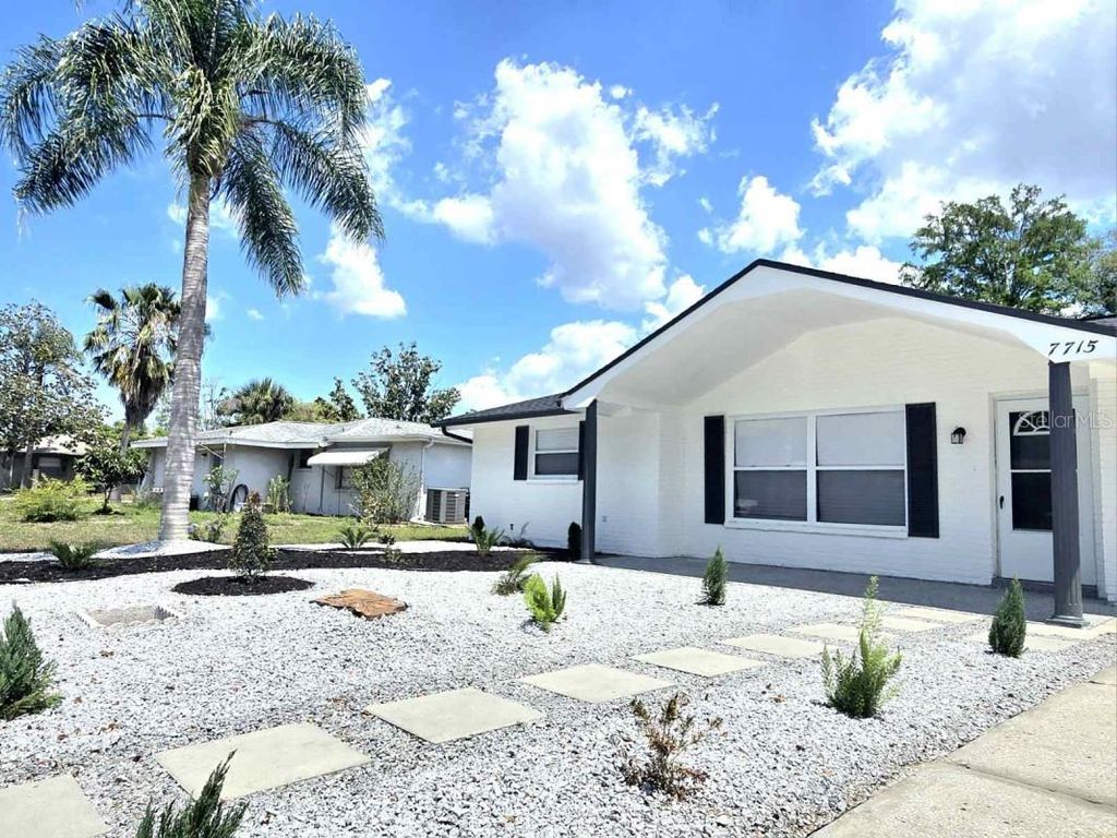 Photo of 7715 Cherrytree Lane, New Port Richey, FL 34653 (MLS # A4690665)