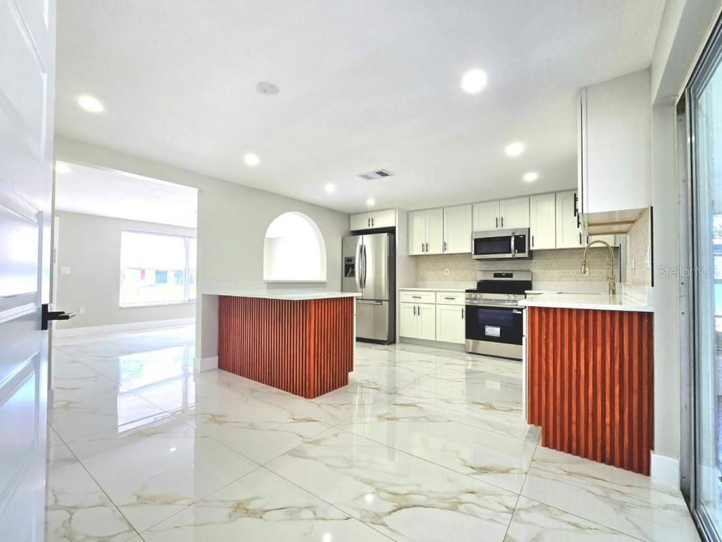 Photo of 7715 Cherrytree Lane, New Port Richey, FL 34653 (MLS # A4690665)