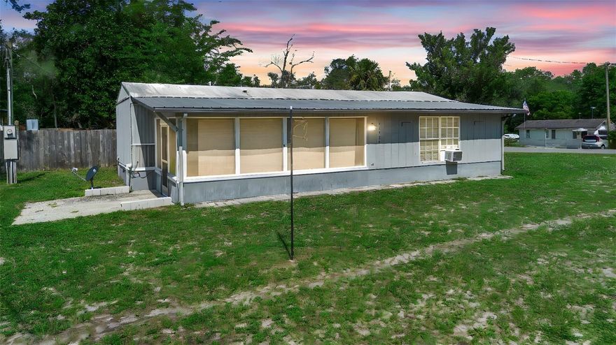 Charming 2 bed, 1 bath manufactured home on a spacious corner lot with **no HOA**—offering freedom and flexible use options! This well-kept property features a large screened patio and a living room addition, perfect for relaxing or entertaining guests. Enjoy central air, a **new well pump, tank, and updated plumbing** for added comfort and peace of mind. Two storage sheds and **plenty of parking** make it ideal for storing boats, RVs, or outdoor gear. Located near peaceful Forest Lake and just 10 minutes from a public boat launch on the St. Johns River, it's a dream for nature lovers and outdoor enthusiasts. Responsible tenants are already in place, making it a great income-producing property or future personal retreat. Whether you're looking for a full-time residence, seasonal getaway, or investment opportunity, this home delivers versatility, convenience, and value. **Information is deemed reliable but not guaranteed.**