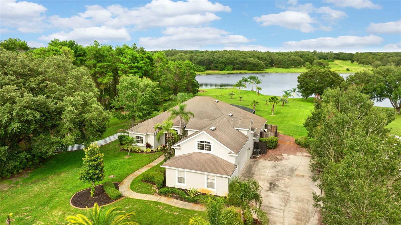 Lakefront home on 3 private acres in Clermont , the perfect blend of comfort, style, and nature with this beautifully updated! Enjoy peaceful water views and outdoor living at its finest, enhanced by thoughtful renovations throughout.
Featuring two master suites !One of the master suites has been fully remodeled, featuring a luxuriously updated bathroom and a spacious, custom-designed walk-in closet. A second new A/C unit ensures efficient, zoned climate control, while the kitchen has been refreshed with updated cabinets and modern hardware — ideal for both everyday use and entertaining.
Step outside to your personal oasis, complete with all-new pool equipment and pump, ready for summer enjoyment. The backyard now offers clear, open views of the lake, with overgrown roots and debris professionally removed to restore the stunning waterfront backdrop.
Additional features include:
• A newly installed 50-amp RV outlet — perfect for guests or your own travel setup
• Stylish cosmetic touches, including a custom grid accent wall
• Peaceful privacy with plenty of space for outdoor recreation, gardening, or expansion
Don’t miss this rare opportunity to own prime lakefront acreage with modern amenities and timeless charm — schedule your private tour today.