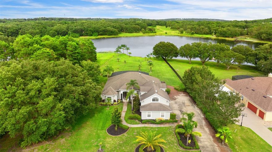 Ask about new roof replacement with the offer ! Lakefront home on 3 private acres in Clermont , the perfect blend of comfort, style, and nature with this beautifully updated! Enjoy peaceful water views and outdoor living at its finest, enhanced by thoughtful renovations throughout.

Featuring two master suites !One of the master suites has been fully remodeled, featuring a luxuriously updated bathroom and a spacious, custom-designed walk-in closet. A second new A/C unit ensures efficient, zoned climate control, while the kitchen has been refreshed with updated cabinets and modern hardware — ideal for both everyday use and entertaining.

Step outside to your personal oasis, complete with all-new pool equipment and pump, ready for summer enjoyment. The backyard now offers clear, open views of the lake, with overgrown roots and debris professionally removed to restore the stunning waterfront backdrop.

Additional features include:
    •    A newly installed 50-amp RV outlet — perfect for guests or your own travel setup
    •    Stylish cosmetic touches, including a custom grid accent wall
    •    Peaceful privacy with plenty of space for outdoor recreation, gardening, or expansion

Don’t miss this rare opportunity to own prime lakefront acreage with modern amenities and timeless charm — schedule your private tour today.