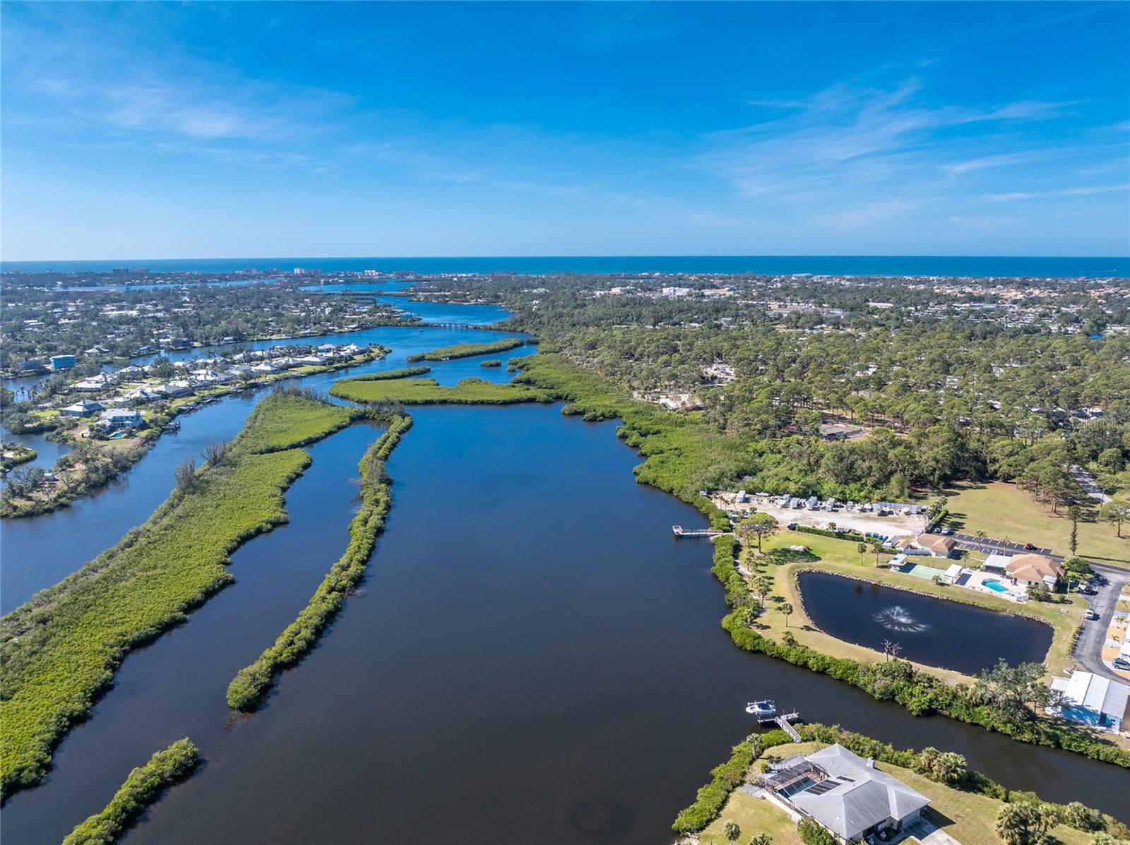 Welcome to Terra Cove, a waterfront community with only 2 fixed bridges to the breathtaking Gulf of America! TURNKEY FURNISHED & move-in ready! This well-maintained home offers exceptional value and comfort as a seasonal retreat or full-time residence. Huge Primary Suite with over 200sf bedroom area, dual closets, and private ensuite bathroom. Expansive Living Room boasting more than 320sf is ideal for relaxing or entertaining family and friends. Florida Room is surrounded by sliding glass doors with sun-filtering window film as well as screens when you prefer to enjoy the Southwest Florida tropical breezes. Laminate Flooring throughout the living areas, tile in bathrooms and Florida room; bedrooms currently carpeted and ready for your flooring preferences. 2025 - Guest bath updated with new flooring, vanity, and toilet; 2021 - New HVAC system including ductwork; tie downs and vapor barrier updated. 2017- Roof-over installed. 2015 - Updated electrical service at pedestal and exterior portion. 2010 - Home re-piped. Updated windows & Bermuda shutters provide added protection. Driveway fits two cars including the outdoor entertaining space. Low-maintenance River Rock landscaping surrounds this home. Rest easy knowing this home has had no damage from recent storms. Take a stroll to the private dock to watch the amazing sunset while you relax or do some fishing! Residents enjoy exclusive access to a private boat ramp, kayak launch, and for a low additional fee, a dedicated storage area for boats, jet skis and RVs. The low HOA fee covers community amenities such as a pool, shuffleboard, recreation building, lawn maintenance, and a "borrow a tool" facility. Terra Cove is a 55+, PET-FREE community. Conveniently situated less than 3 miles from Nokomis Beach, 1/2 mile from the Legacy Trail, and 2 miles from Sarasota Memorial Hospital in Venice, this home is also close to shopping, dining, golf courses and I-75 access. Check out the walk through video at youtu.be/N3wUusZAUOI