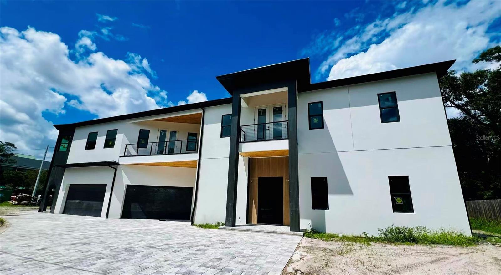 Under Construction. Under Construction luxury custom home in the very desirable Bay View neighborhood in South Tampa. No flood zone! Anticipated completion toward the end of 2025. This custom built home features 5 bedrooms, office, entertaining room, gym, 2 study rooms, 6 full bathrooms, 2 powder bathrooms and an oversized 3 car garage situated on a generous corner lot. This contemporary and warm home truly combines functionality and style! To name a few features; Level 4 drywall, Hickory engineered wood flooring, 12 feet ceiling on the 1st floor and 10 feet ceiling on the 2nd floor, Monogram brand appliances, outdoor kitchen, Four AC units, four under the counter refrigerators, electric fireplace, rare two driveways, two balconies on the 2nd floor, Sunroom in the master suite, three laundry places including the laundry room, master suite laundry and in law suite laundry. The first floor features an in-law suite, gym and office. Nice patio with outdoor kitchen and paved backyard. The second floor has an open lobby, the master suite , three more bedrooms, and a media/entertaining room. Unbeatable location right behind Plant High school. The house is within 15 minutes to Tampa International Airport, Veteran's Express and I-275, within 10 minutes to Hyde Park Village & Downtown Tampa, and within 5 minutes to Palma Ceia Golf & Country Club. A-Rated school district with Roosevelt Elementary, Coleman Middle and Plant High. There is no CDD or HOA to worry about either!