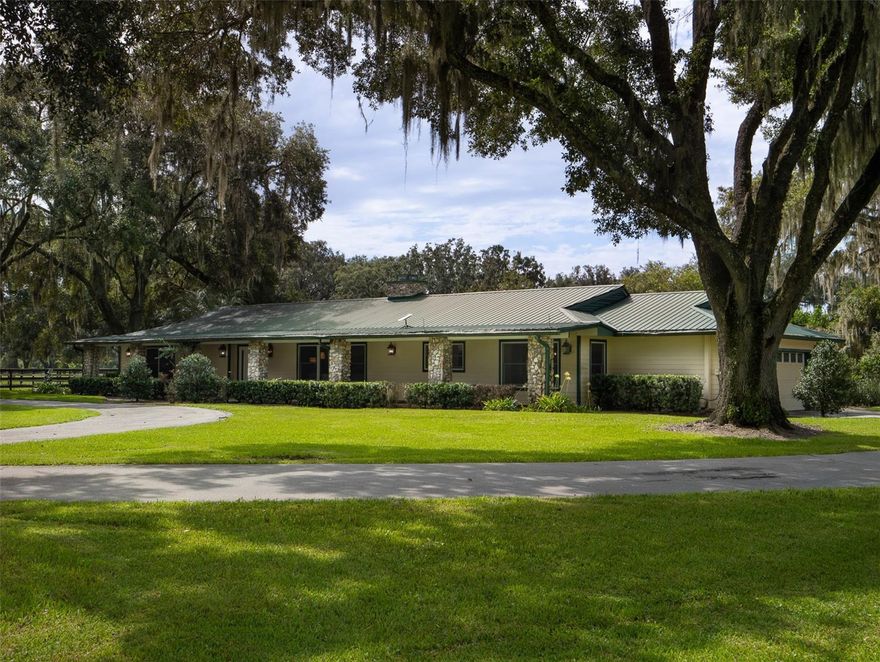 This approximately 38.65-acre property in Ocala, is just 12 minutes from the World Equestrian Center! The land features beautiful granddaddy oaks and well maintained pastures. The expansive 4-bedroom, 3.5-bath home showcases a charming stone fireplace and a tranquil screened-in pool area. The 12-stall barn, complete with a tack room, feed room, wash bay, and an expansive second-story hay storage, is the ideal setup. Additionally, the property includes a large 3-bay equipment building/workshop and an RV hookup, offering versatility and readiness for a wide range of uses. Additional acreage available.
