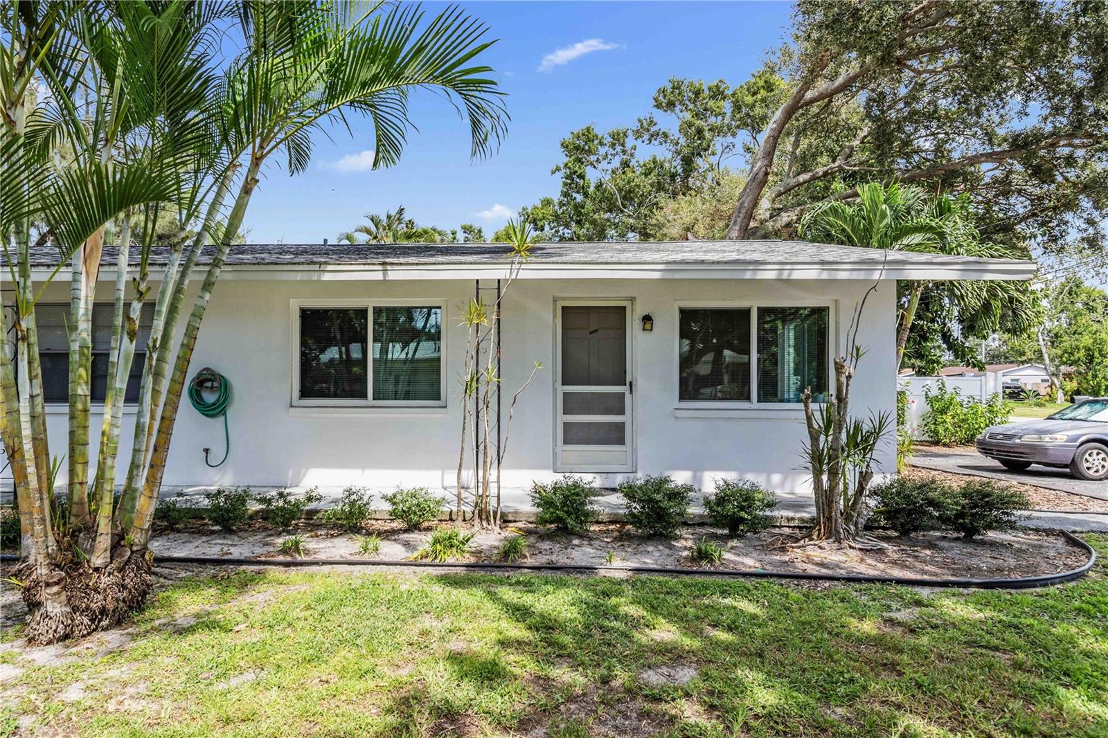 ANNUAL RENTAL - Neat and clean two bedroom, one bath corner unit apartment in a centrally located residential neighborhood surrounded by large trees and a nice courtyard. Ground level unit, hurricane windows, tile floors throughout, and plenty of parking make this easy living. Very well maintained block construction building in an X flood zone. Close to retail shopping and numerous restaurants. Sewer, water, trash, and lawn care are included in the rent. All other utilities are the tenant's responsibility. All tenants 18+ are required to submit a $65 application. Upon approval, a $100 tenant processing fee, $1500 security deposit, and first month's rent is due. The tenant is required to carry tenant insurance & liability coverage, which is an additional $45/month.
