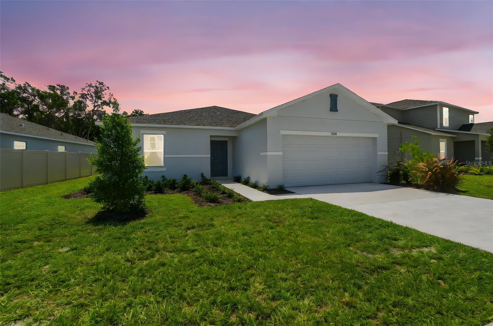 Seller offering up to 3% toward buyer’s closing costs, prepaid expenses, or interest rate buy-down! Discover this brand-new Ambrosia floor plan by Taylor Morrison, complete with a full home warranty and no CDD fees. Step inside through a large foyer featuring 18” x 18” ceramic tile flooring, leading to a split floor plan designed for both privacy and functionality. To the left, two guest bedrooms share a full bath with quartz countertops and ceramic tile flooring, all with new carpet underfoot. The heart of the home includes a large dining area and an open family room filled with natural light from expansive windows, offering serene pond and patio views. Adjacent is the chef-inspired kitchen that boasts quartz countertops, a large island, white shaker cabinetry with 36” uppers, stainless steel appliances, and a walk-in pantry. Sliding glass doors open to an extended patio and oversized backyard with no rear neighbors. Retreat to the primary suite, where abundant light and space set the tone. The primary bath features dual vanities with quartz countertops, a walk-in shower, a large linen closet, and an oversized walk-in closet. Additional highlights include: 18” x 18” tile throughout main living areas and wet rooms Polyaspartic garage flooring, Hurricane shutters and double-pane tilt-out windows as well as double-pane sliders, Blinds throughout, Wi-Fi thermostat, coded front entry lock, and Wi-Fi garage door opener. Pond view with no rear neighbors! Enjoy resort-style community amenities including a pool, cabana, tot lot, open lawn, butterfly garden, and dog park. Located in vibrant Hudson, FL, just minutes from Hudson Beach, Sunwest Park, and Weeki Wachee Springs, this home offers easy access to both relaxation and adventure.