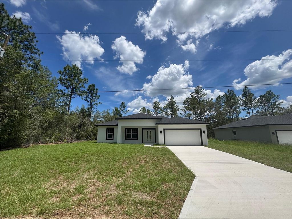 Photo of 142 W Diego Place, Citrus Springs, FL 34434 (MLS # O6319655)