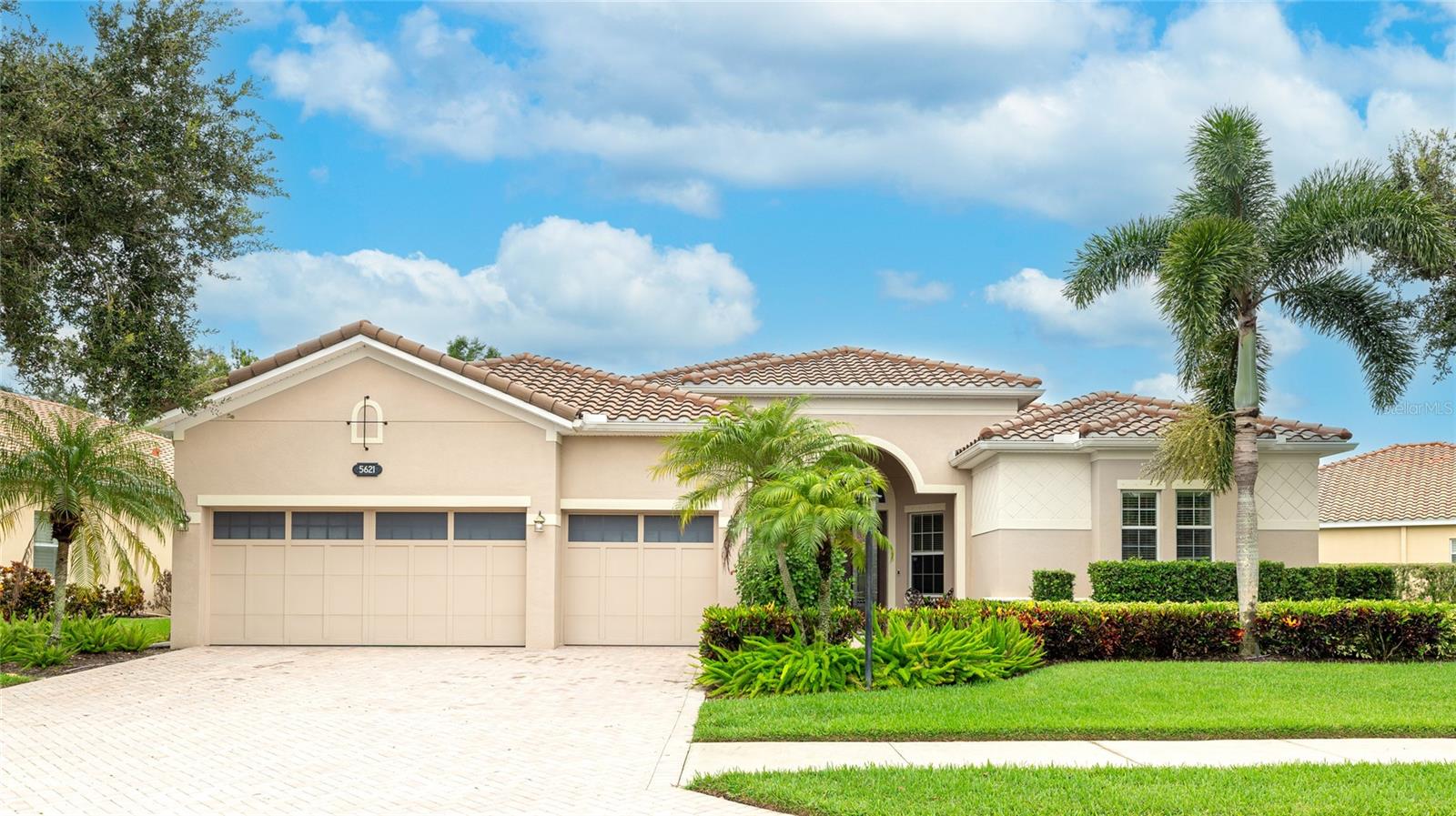 Welcome to Red Hawk Reserve, one of Sarasota’s most sought-after gated communities, where privacy, elegance, and convenience come together. This expansive 4-bedroom, 3-bathroom residence offers more than 3,400 sq. ft. of thoughtfully designed living space on a premium preserve lot.
From the moment you step through the upgraded designer-glass entry doors, soaring 12 ft. ceilings, 8 ft. interior doors, and wide-open living areas create an atmosphere of light and space. Fine details include 20” porcelain tile, crown molding in every room, Corian windowsills, custom closets, and upgraded lighting and window treatments that add both style and function.
The gourmet kitchen is the heart of the home, featuring refinished cabinetry, granite countertops, stainless steel appliances, and a bar area perfect for entertaining. The living room flows seamlessly to the lanai, where sliding glass doors open to the heated pool and views of the peaceful nature preserve beyond.
The private owner’s suite is a true retreat, highlighted by a dual-tray ceiling, direct access to the lanai, two walk-in closets, and a spa-style bath with dual vanities, garden tub, and walk-in shower. Secondary bedrooms include a Jack-and-Jill layout, plus a separate guest suite for flexibility. A dedicated office/den and formal dining room provide options for work, play, or additional sleeping space.
Recent updates bring peace of mind and comfort: New Interior Paint (2025), engineered hardwood flooring in all bedrooms (2020), fresh interior paint (2023), and a new A/C unit (2024). Safety features include upgraded hurricane shutters, smoke detectors, and a pool child gate.
Located within Sarasota’s top-rated school district, this home is just minutes from I-75, shopping, dining, hospitals, golf, and the world-renowned Siesta Key Beach. Red Hawk Reserve combines an ideal central location with a tranquil, private setting.
This is where luxury living and everyday convenience meet—an opportunity not to be missed. Be sure to experience the 3D-Matterport Virtual Walkthrough and set an appointment today!