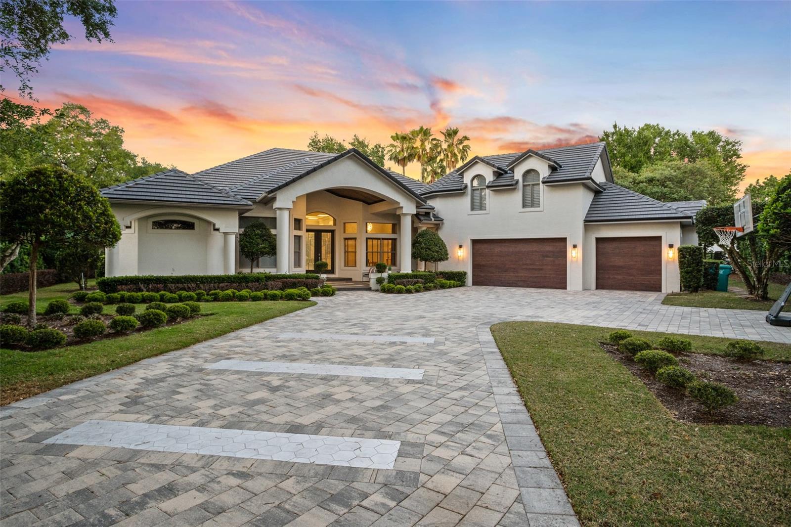 Welcome home to this impressive and recently updated golf front home located in Lake Nona Golf and Country Club. Private and tucked away on a coul-de-sac, this two-story home boasts quality finishes throughout. With great curb appeal and an adorable front porch, it is hard not to fall in love with this one. As you walk in through the double front doors you are immediately greeted by incredible unobstructed views of the world famous Lake Nona Golf and Country Club championship golf course through the 90-degree sliders. This also provides an abundance of natural light, and offers indoor-outdoor living at its finest. Some of the most recent updates to this home include a complete renovation of the kitchen, updated bathrooms, and pool area. The chef’s kitchen features a beautiful and oversize island, stainless steel Thermador appliances, and light colored cabinets. The living room is just off the kitchen and is the perfect spot to entertain or to hang with family and friends. The downstairs master bedroom features French doors that lead out to the covered lanai. The master bathroom also has recent upgrades including a modern vanity with two sinks, marble throughout, a beautiful tub and a large walk-in glass shower with custom tile throughout. Adjacent to the master is an additional bedroom that has a bathroom across the hall- which doubles as the pool bath. The two additional downstairs bedrooms have built in closet systems and share a bathroom. The upstairs is perfect for a bonus room, or spot to watch sports games and features a wet bar. One of the most special features of this house is the outdoor living space. The covered lanai is the perfect place to enjoy the Florida weather while sitting with family and friends. The recently updated swimming pool has been thoughtfully designed- featuring a lounge area, and two separate sets of steps. The pool deck area has plenty of space for plenty of seating. Sit back, relax and enjoy the beautiful outdoors with incredible views of the fourth and fifth hole of one of Florida’s most recognized championship golf courses. To the right side of the home there is a large portion of the lot that is currently undeveloped and could be used to add square footage to the home if your family requires additional space. Don’t miss the opportunity to own a beautiful home inside the gates of Lake Nona Golf and Country Club.