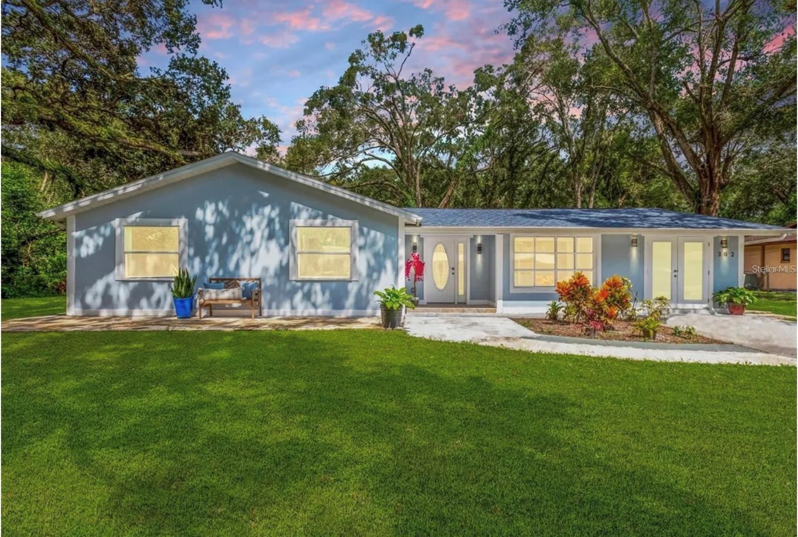 One or more photos have been virtually staged. This completely renovated 4-bedroom, 3-bathroom home is conveniently located just minutes from downtown Tampa, yet boasts nearly 1/2 acre of land for further development and turning it into your dream home. The renovated kitchen, with a large island, quartz countertops, new appliances, and a double oven, is the perfect kitchen for entertaining family or friends. For added convenience, there are two mother-in-law sinks that can be used as income sources. The roof is almost 3 years old. All bathrooms incorporate the latest technology and feature clean, modern designs. The laundry room is located inside the home, along with space for a home office or a large utility room for dog lovers. Located at the end of the street, with only one side neighbor and no through traffic. NO HOA OR CDD! Don't miss the opportunity to come see it.