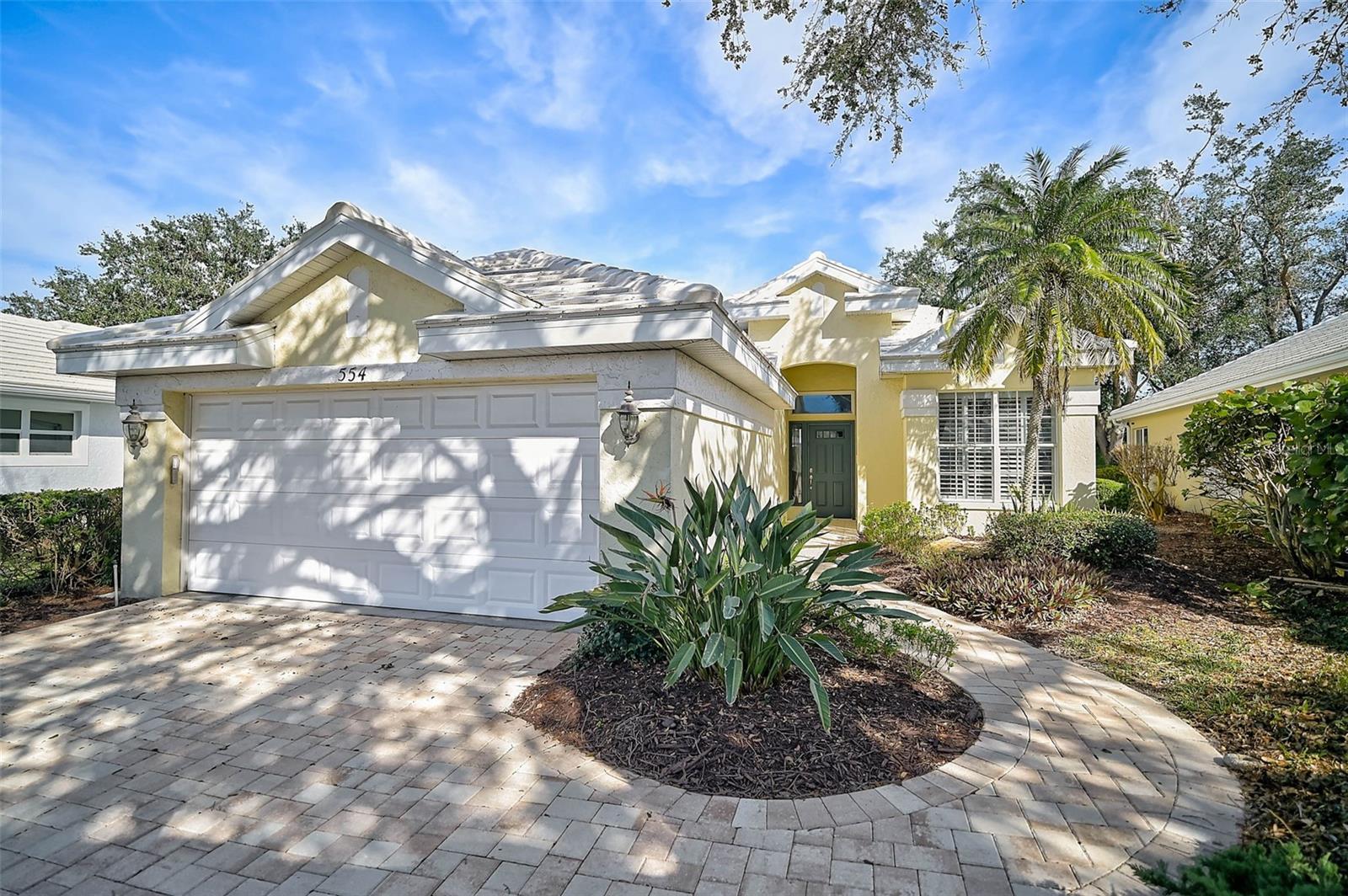 PRICED TO SELL! Come and make an offer on this beautiful home and LIFESTYLE in the established Venice Golf & Country Club, a premier gated Venice community. The home is immaculately maintained and located in the maintenance free Wentworth neighborhood of VGCC and is awaiting your arrival. As you walk up to the entrance, a brand-new paver walkway & driveway has been added leading to the house with beautiful mature plantings and an Oak tree to call your very own. Upon entering the home, you are greeted with a spacious and open dining & living room. Your eye immediately goes to the newly installed Amber Oak flooring throughout the entire home. The bright open floor plan expands through the sliding glass doors and brings your eye to a serene lanai area set among subtropical foliage. The kitchen is situated nicely with another additional eating area. The appliances have all been updated. There is a primary ensuite master & master bath that has a separate shower & soaking tub. There are two other bedrooms and a hall bath with a combined shower/tub. BONUS: Your "Club Car" golf cart with charging unit is included. Now that you have your house let's describe your lifestyle! VGCC is a paradise for golf lovers. VGCC is the only private member owned golf course in Venice, Florida with an 18-hole championship challenging golf course designed by Ted McAnlis. For the tennis and fitness lover, the Club boasts Har-Tru tennis courts with a state-of-the-art Wellness Center with on-site physical & massage therapists as well as an Olympic Jr. sized pool & spa. The community is very active with member socials and activities. The Clubhouse dining room has been newly renovated and expanded and dining options are fantastic. Location is ideal as you are situated in close proximity to shopping, dining & the beautiful beaches of Venice. This home is truly a special place in a happy and peaceful setting!