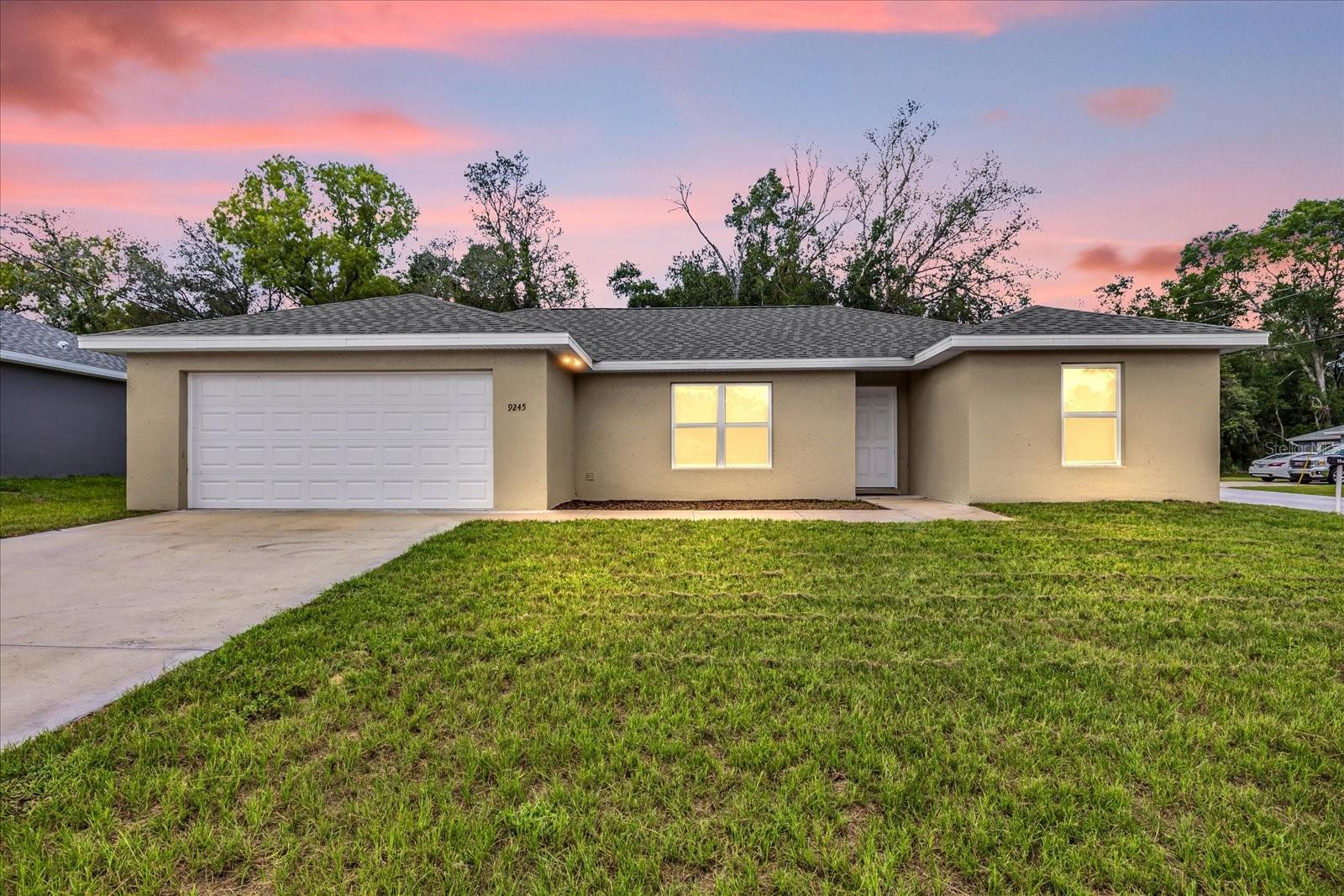 This recently built 2023 home offers 3 bedrooms, 2 bathrooms and is situated in the highly desirable Orange Blossom Hills neighborhood. The home boasts a split-bedroom floor plan with an open concept living room, dining area, and kitchen equipped granite countertops and stainless steel appliances. The primary bedroom is complete with an office/nursery nook, a walk-in closet, and an en suite bathroom with a tiled shower. The remaining bedrooms share a guest bathroom with a bathtub. Upgrades throughout the home include vaulted ceilings, luxury vinyl plank flooring for easy maintenance, granite countertops in both bathrooms, and a laundry area with washer/dryer hookup. The property also features a spacious backyard and patio situated on a 1/4 acre corner lot. Located just minutes away from Lake Weir and The Villages with convenient access to I-75, US-441, 301, and HWY 25. NO HOA! Don’t miss out on this opportunity to make this home yours! Submit your offer today!