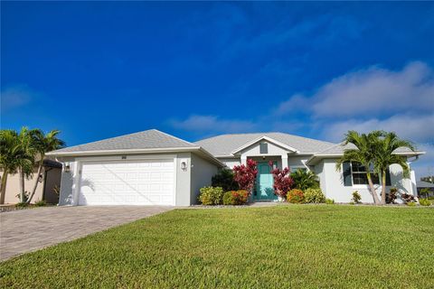 Photo of 916 Boundary Boulevard, Rotonda West, FL 33947 (MLS # O6356630) Photo of 916 Boundary Boulevard, Rotonda West, FL 33947 (MLS # O6356630)