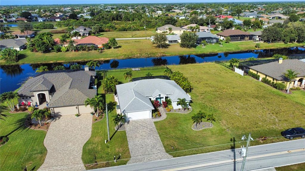 Photo of 916 Boundary Boulevard, Rotonda West, FL 33947 (MLS # O6356630)