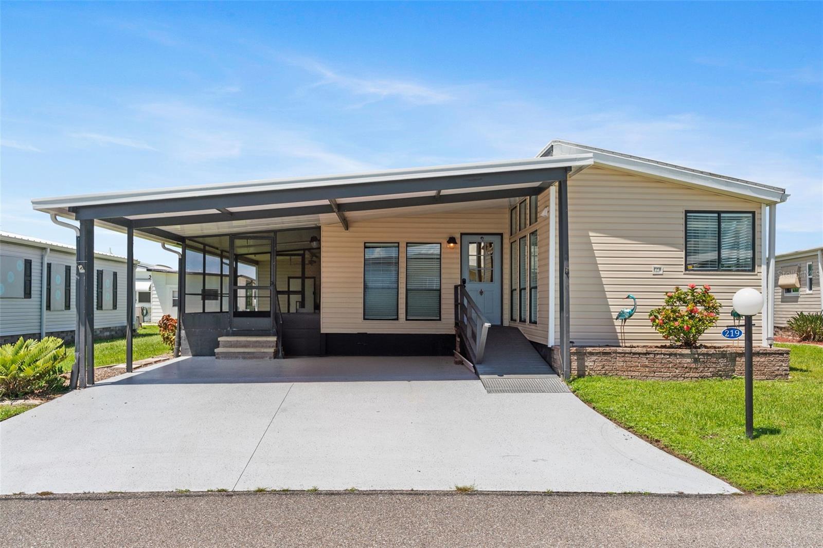 Move-in ready! Some furnishings included! This 2 bed 2 bath home has updates with all new siding, baseboards, carport, etc and a 2019 roof–a sweet deal in this sought-after location!! With the best amenities, clubs, and selection of activities you’ll find in any co-op park around–and located on the banks of the Myakka river–Lazy River Village is one of the premiere (if not THE best) 55+ waterfront manufactured parks in all of Sarasota and Charlotte county!
With cathedral ceilings, bright walls, and handsome laminate flooring, this home’s classy, chic interior will accommodate any decor or stylings of your choosing. The spacious master bedroom leads to a well-lit master bath featuring a double-sink counter and glass-door shower. In the kitchen, multiple large windows allow plenty of light to reveal a sleek kitchen island with drawers & eating area, as well as plenty of solid surface counter space and windows near the sink. A bright, open living room/dining area leads out, through sliding doors, to a shaded deck that provides the perfect spot to sit and enjoy beautiful Florida evenings while taking cover from heat and bugs.
This home is the perfect seasonal place to enjoy Florida's coveted gorgeous winters and a perfect year-round home for those who love all 4 seasons of Florida. If you enjoy an abundance of activities, you will have plenty to choose from in Lazy River Village: Pickleball, tennis, bike clubs, card clubs, and pontoon boating. They even have a professional woodworking shop. A low monthly fee of $276 includes all the amenities. There are other amenities for an extra fee, such as a marina slip if your home is not located on the water.
One of the things that makes Lazy River Village so great is its proximity to...well...everything! Be prepared to enjoy Florida's wildlife at its finest, both inside the Lazy River Village complex and at abundant state parks and nature preserves. Shopping and dining surround you in all directions. The spring training homes of both the Atlanta Braves & the Tampa Bay Rays are just minutes away. The world-renowned Gulf beaches are all within 30 minutes or less! 1) Englewood beach, 2) Casperson Beach (GREAT for shelling), 3) Venice Beach (shark tooth capital of the world), 4) Brohard Paw Park, 5) Nokomis beach (you've GOT to experience the weekly drum circles), 6) the island gem of southwest Florida: Boca Grande... And finally: 7) Siesta Key in Sarasota has been ranked multiple times as the number one beach in the nation and is a mere 35 minutes away. Lazy River Village offers a lifestyle that every retiree dreams of. You have the quaint downtowns of Venice and Punta Gorda--both cities are often ranked as Top 10 destinations in the country for retirement. Another local favorite, Englewood, is a cozy, fun beach town on the Gulf.
The residents of Lazy River Village agree: Lazy River is a community that offers it all. Don't miss your chance to see this home!