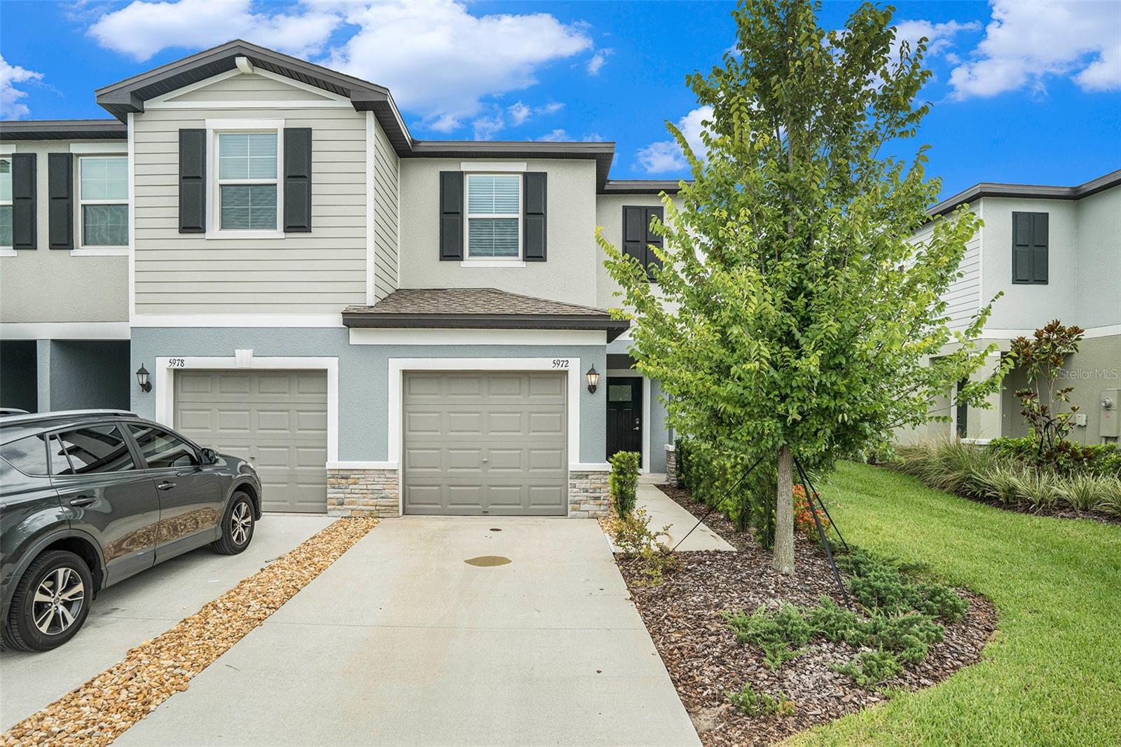 This furnished Townhome is move-in ready! A 2 bedroom, 2.5 bath home that was built in 2023 which offers easy access to highways 54, 41 and the veterans expy/Suncoast pkwy. The first floor of this two-story townhouse includes a half bath, spacious great room with direct access to a well-furnished kitchen including a cozy nook leading out to an attached screened-in covered patio. Upstairs leads to a multipurpose loft dividing the impressive water view suite from the additional bedroom, both of which have full size bathrooms for convenience. On-site amenities include a community pool with cabanas, nearby park, shopping, dining, entertainment and a Land O' Lakes recreational facility. Schedule a viewing today, it has everything you could ever need to enjoy the outdoors!